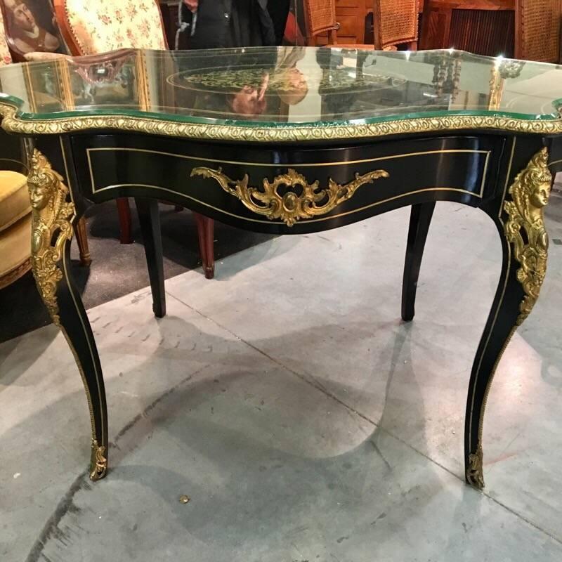 Napoleon III desk in ebonized wood and bronzes, one central draw, cut crystal top.
