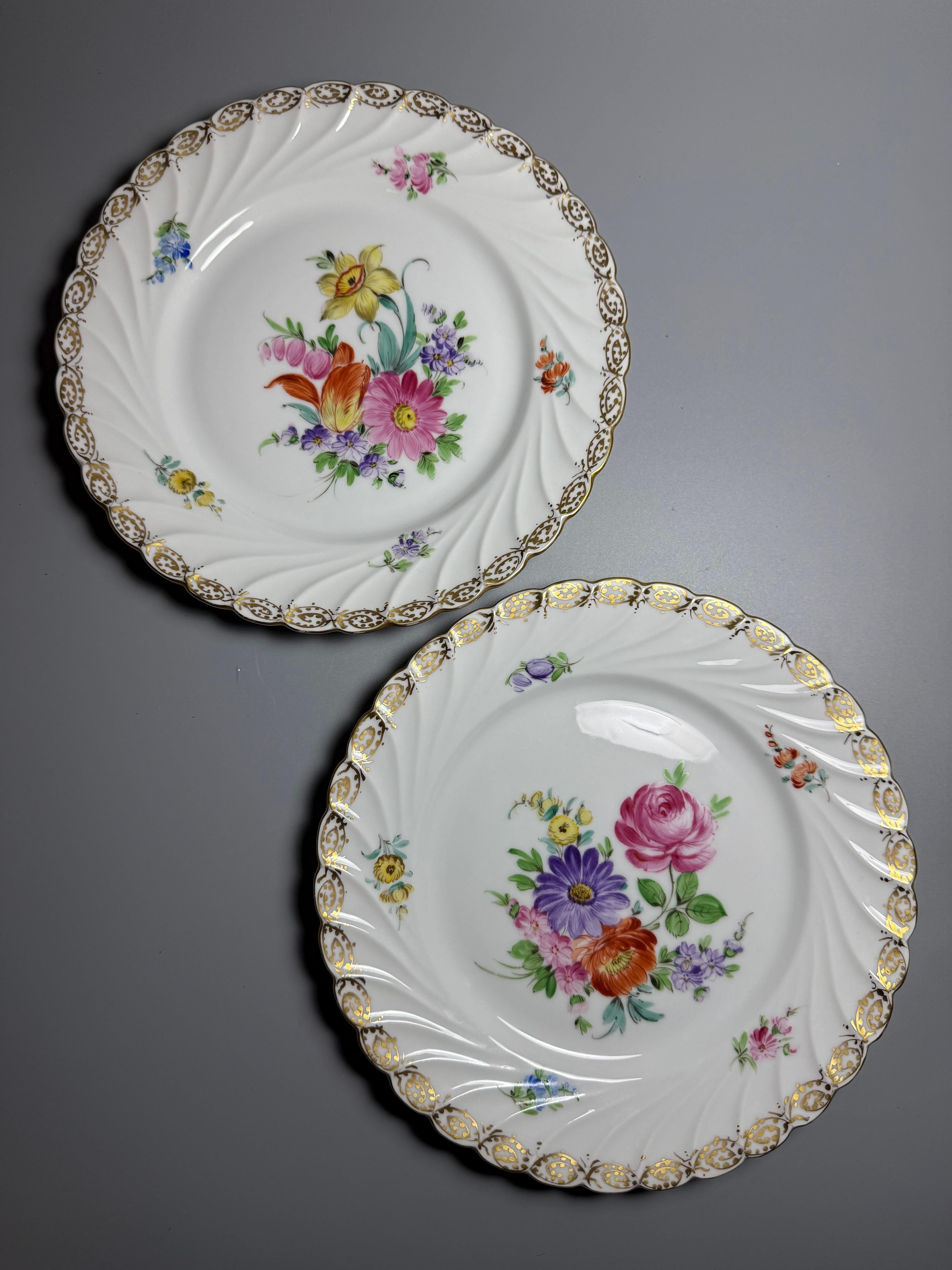  Two Antique Dresden porcelain dessert or salad plates from the end of 19th century, featuring hand-painted floral motifs and a gold-trimmed, scalloped edge. 
Origin: Dresden,Donath & Co, Germany, known for its fine porcelain. 
Porcelain decorating