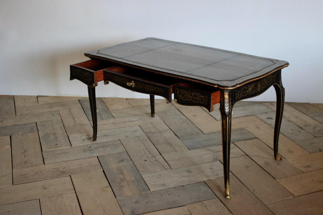An exceptional 19th century, French Napoleon III desk, in ebony with brass inlay, circa 1880, France.
Measures: Knee height 59cm.