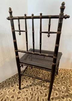 Poltroncina Napoleone III in finto bambù dipinto a canne, XIX secolo