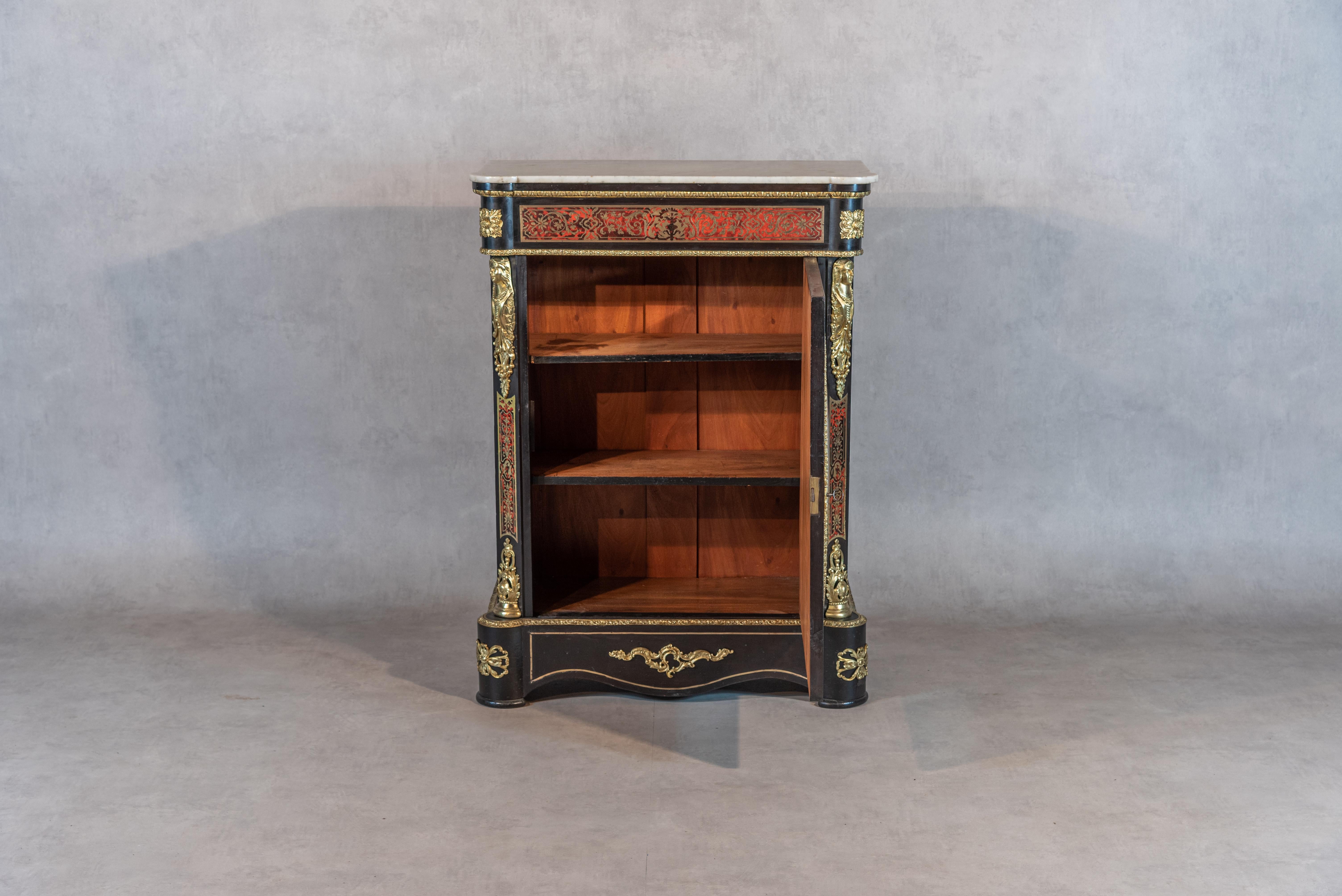Bring a touch of elegance to your home with this superb 19th-century French Boulle buffet or cabinet, hailing from the Napoleon III period. This rare and authentic piece boasts stunning brass and bronze ornamentations, creating an exquisite contrast