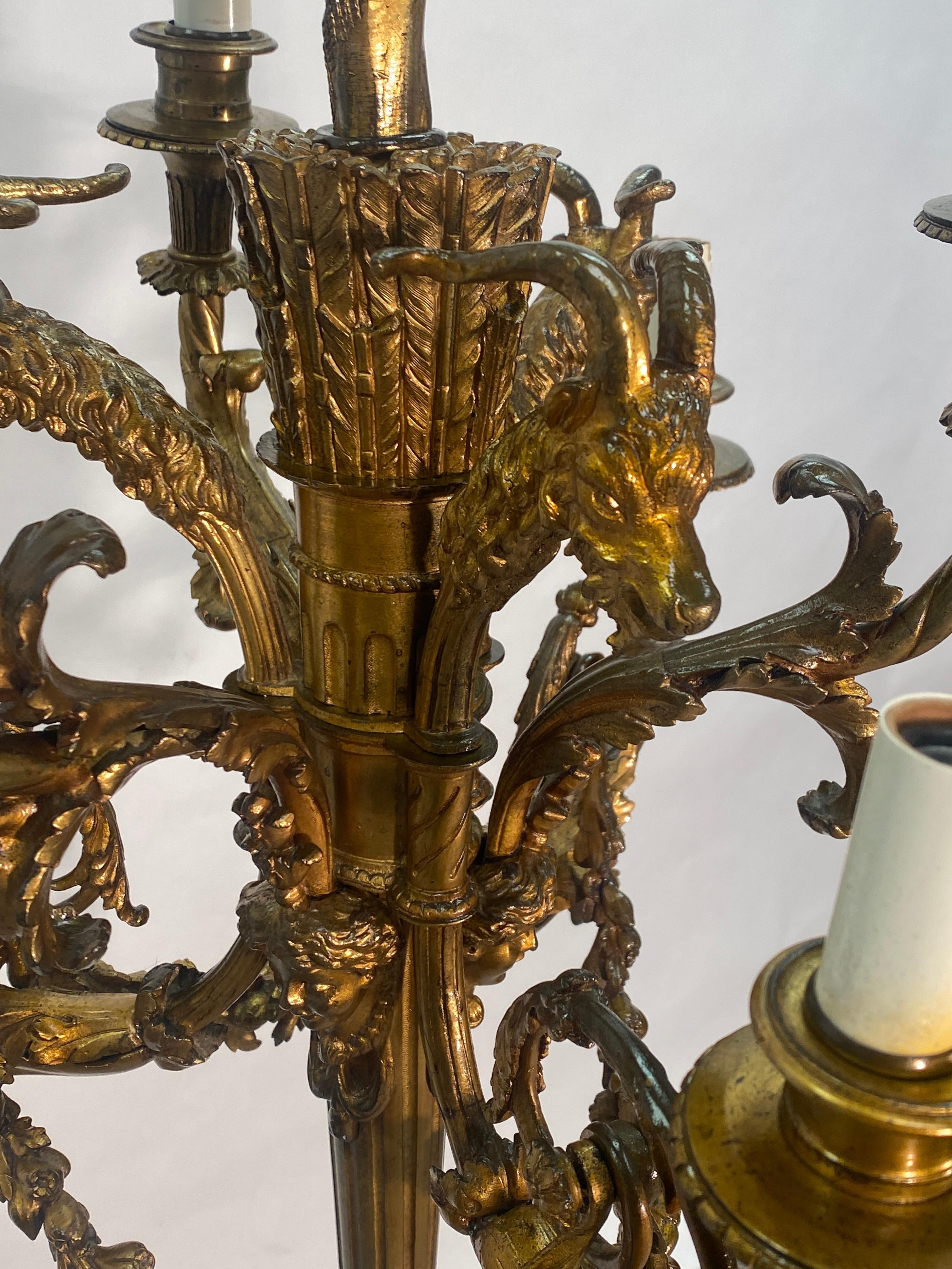 Early 20th century French bronze chandelier in the style of Napoleon III or neoclassical design. Six lights, highly detailed bronze details.