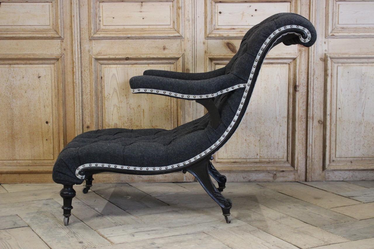 A fine quality and of a very unusual shape, Napoleon III French ebonized club chair, having been reupholstered by us in a grey wool. This unusual armchair will make a statement in most settings. 

Measures: 33cm high (floor to seat). 
 