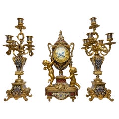 Napoleon III Gilt-Bronze and Enamel Figural Mantel Clock and Candelabras