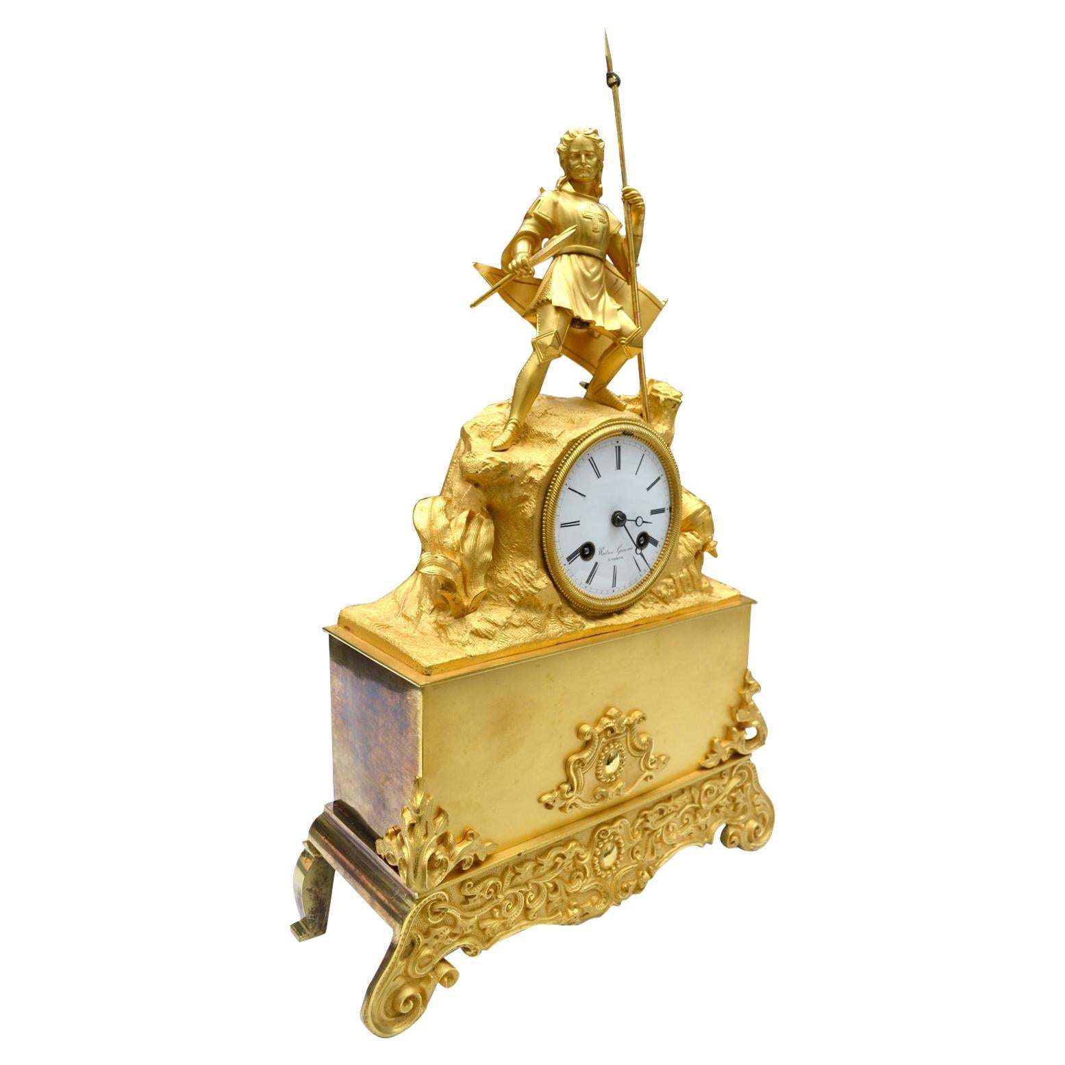 Orologio figurativo in bronzo dorato Napoleone III con cavaliere crociato in battaglia