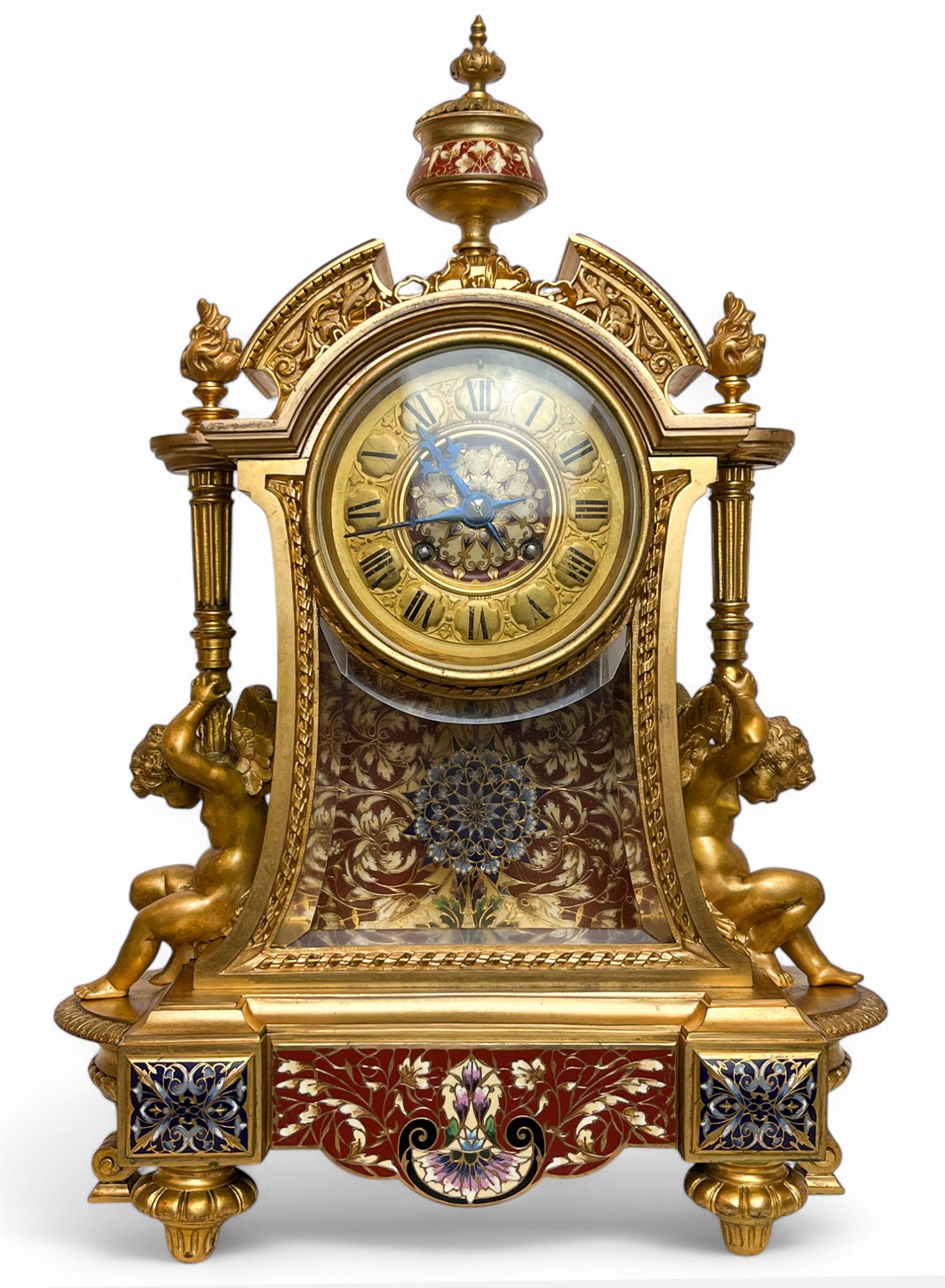 Napoleon III Gilt-Bronze, Champlevé Enamel & Glass Mantel Clock with matching Champlevé Candelabras 

Clock face marks: 

Bigelow Kennard & Co. / Chicago 

Late 19th/early 20th century

Clock: 17.5