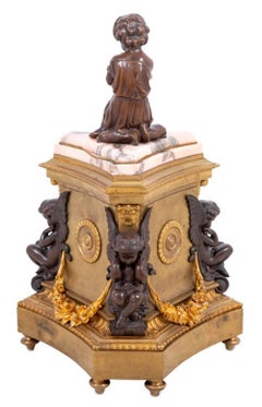 Figurale Napoleon III.-Uhr aus vergoldeter und patinierter Bronze