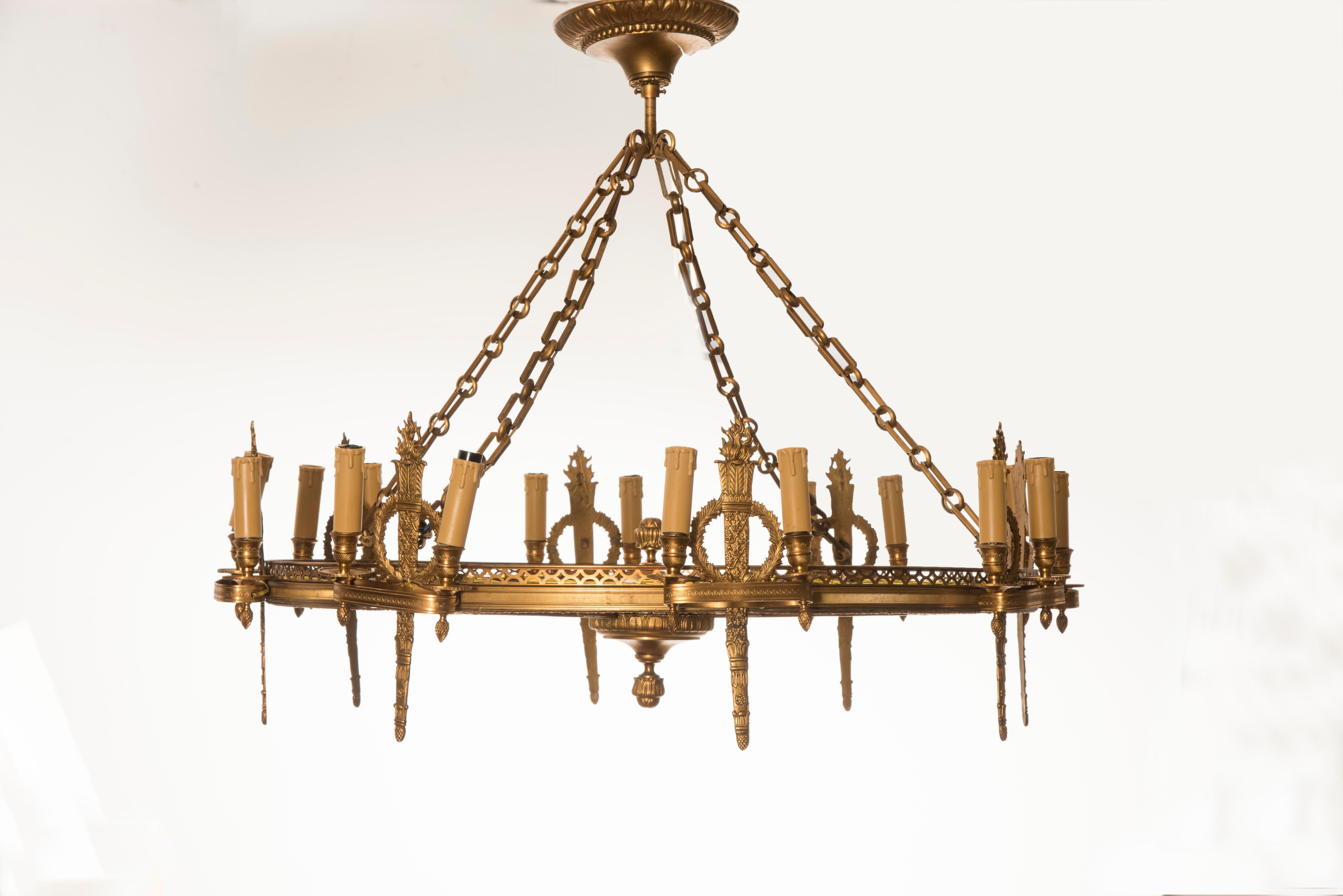 Napoleon III golden bronze eight-light rounded chandelier, from France from late 19th century in correspondence of each light holder there is quiver shaped bronze decoration. 

The chandelier is in excellent conditions. We have completely restored