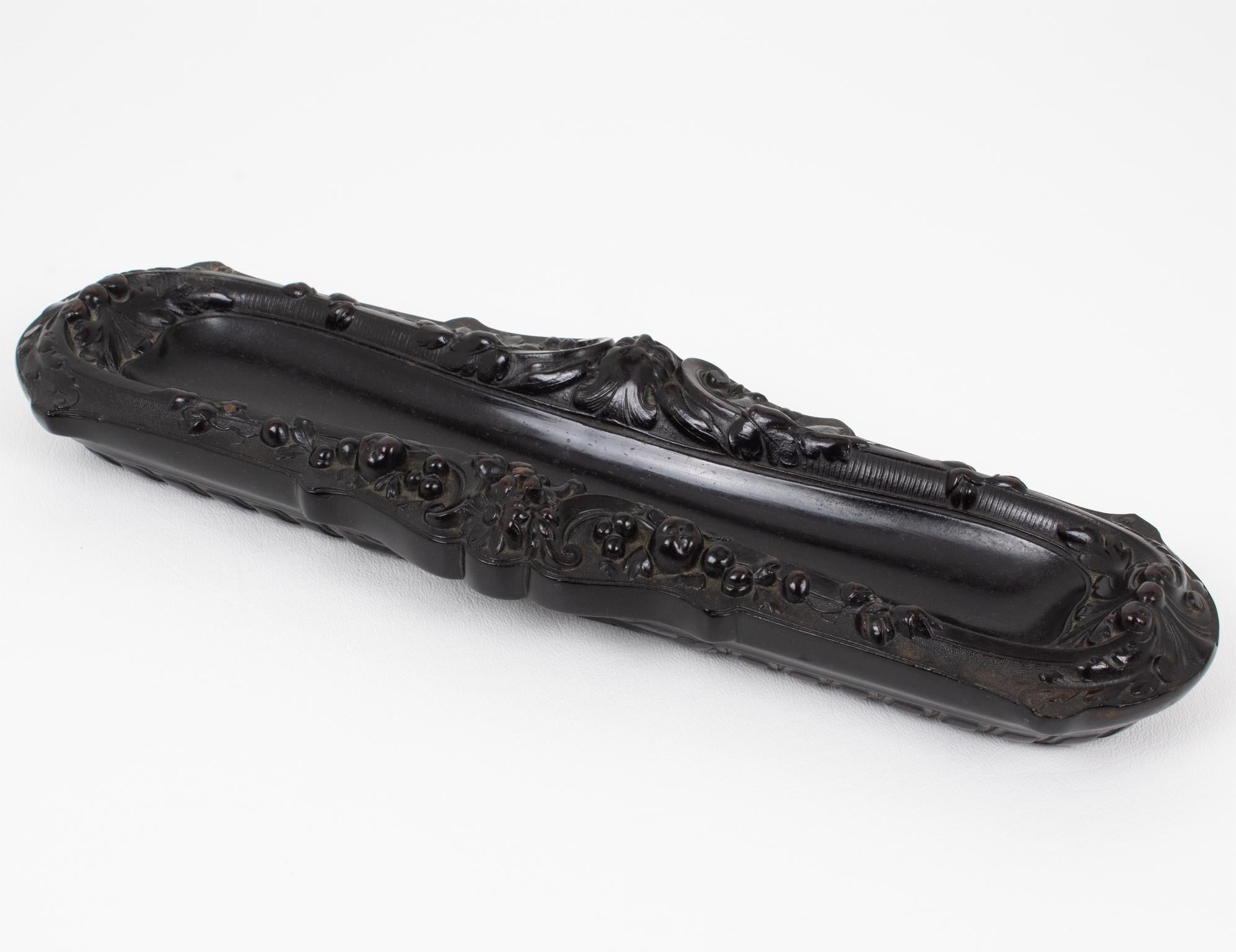 This superb Napoleon III Gutta Percha pen holder was handcrafted in France, circa 1880. The antique desk accessory is exquisitely crafted with different molded designs on each side and delicate ornamentation throughout. There is no visible maker's
