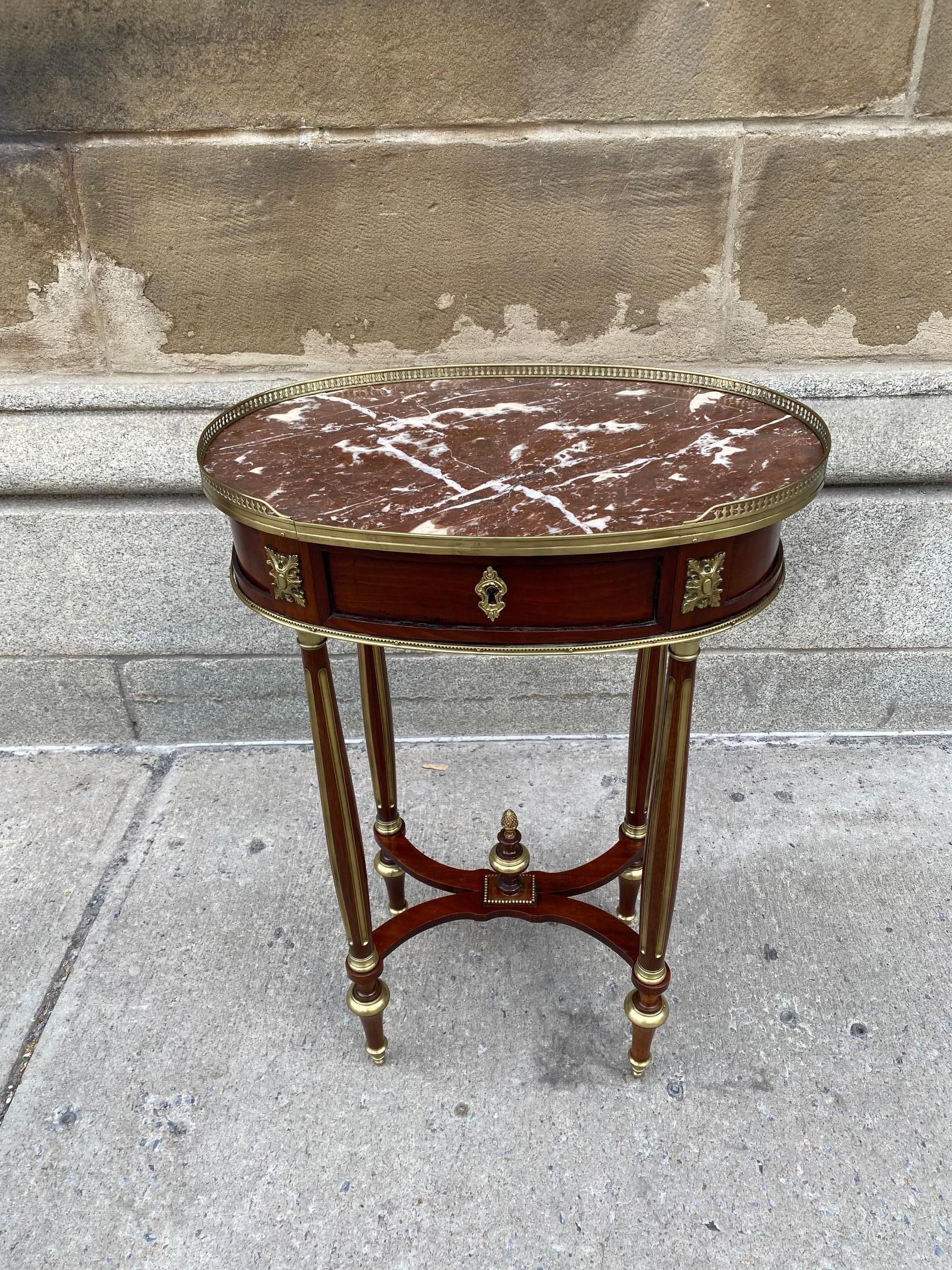 Napoleon III Louis XVI Style Mahogany Side table inset with rouge Languedoc marble top and decorated with brass railing.