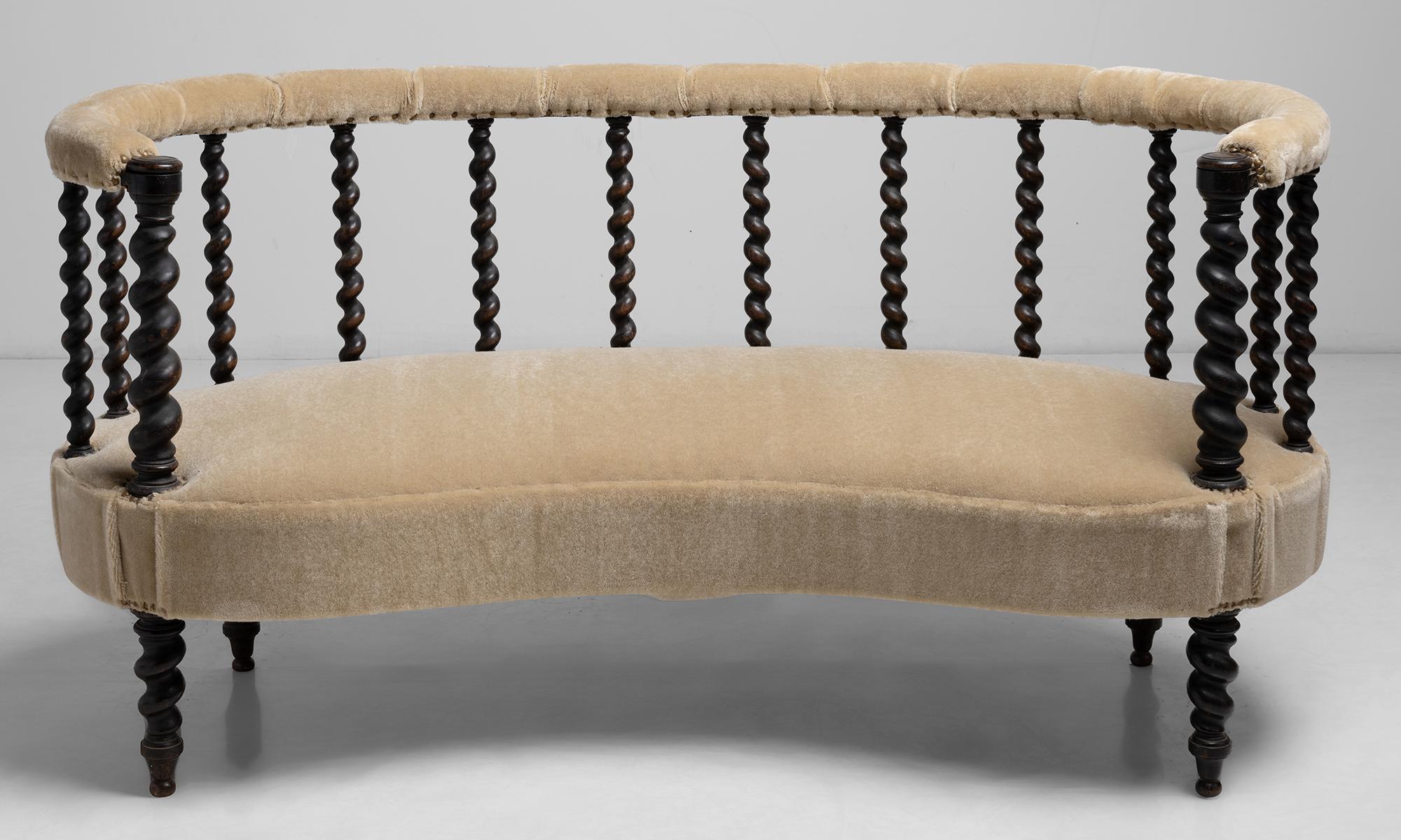 Napoleon III Loveseat.

France Circa 1850.

Gently curved sofa with barley twist frame, newly upholstered in Mohair by Rosemary Hallgarten.

Measures: 61