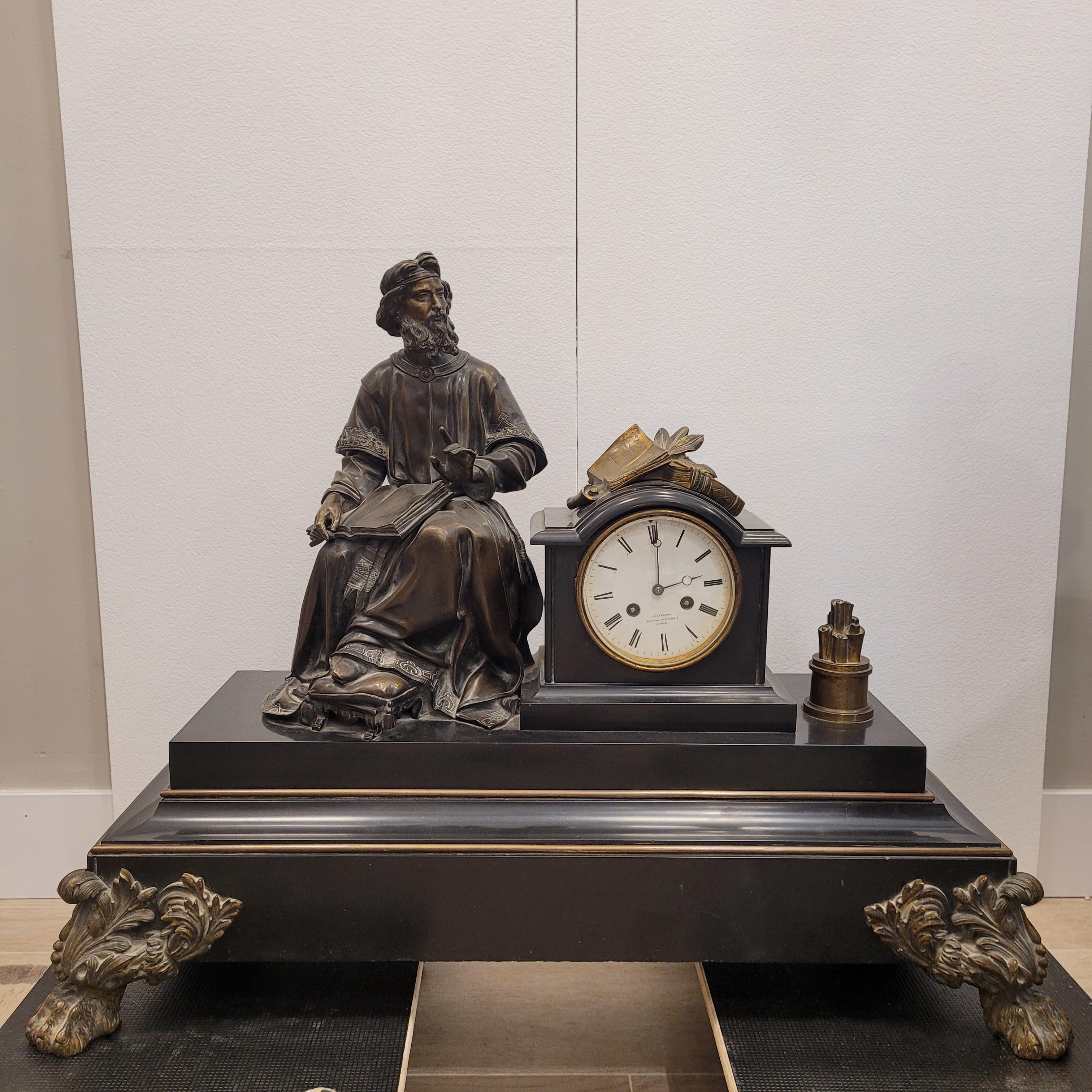 Napoleon III Mantel  clock  in Black marble clock surmounted by a patinated bronze representing a Greek writer or philosopher holding the  a manuscript 
on his knees
One of a kind and very  large, bronze, French mantel clock with a sculpture of a