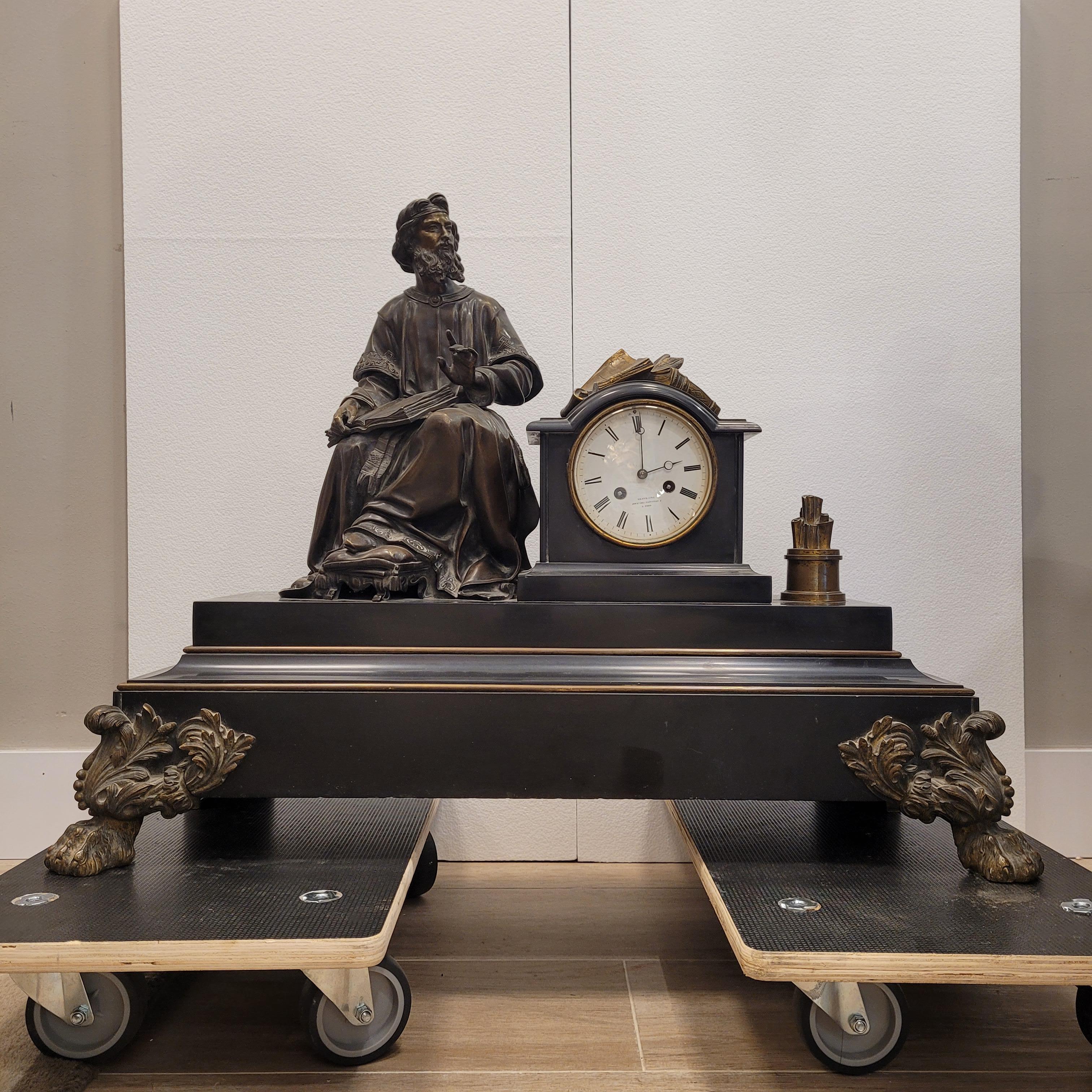 French Napoleon III Mantel  clock  in Black marble and bronce philosopher sculture For Sale