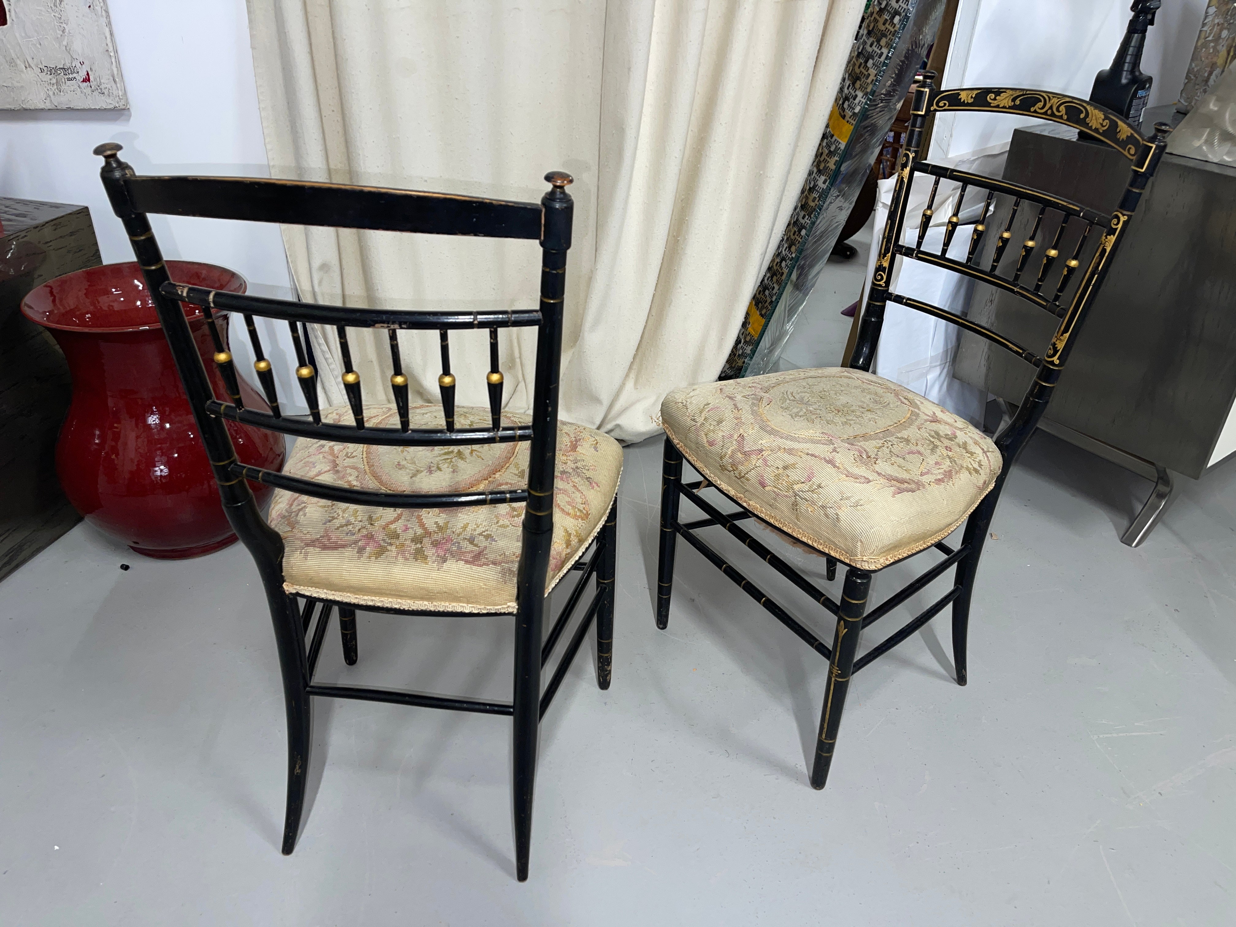 Beautiful pair of Napoleon III chairs with nice needlepoint seats. Chairs have some paint loss and one chair has a small bit of fraying to the border left front. The duvet bottom covers is also slightly torn. Nice overall condition for chairs of