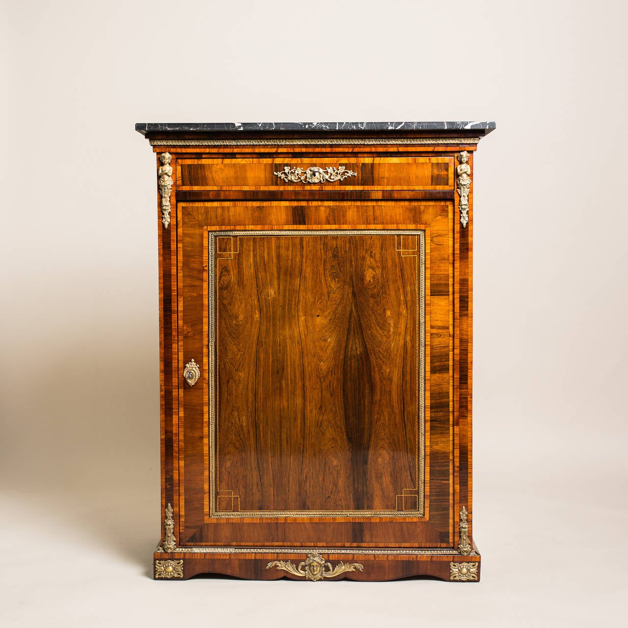 Marvellous nut wood half cabinet/ Vertiko from the Napoleon III period in France, circa 1880. Veneered in fine nut wood, this prestigious antique half cabinet impresses with outstanding inlay works made of different precious woods, which were