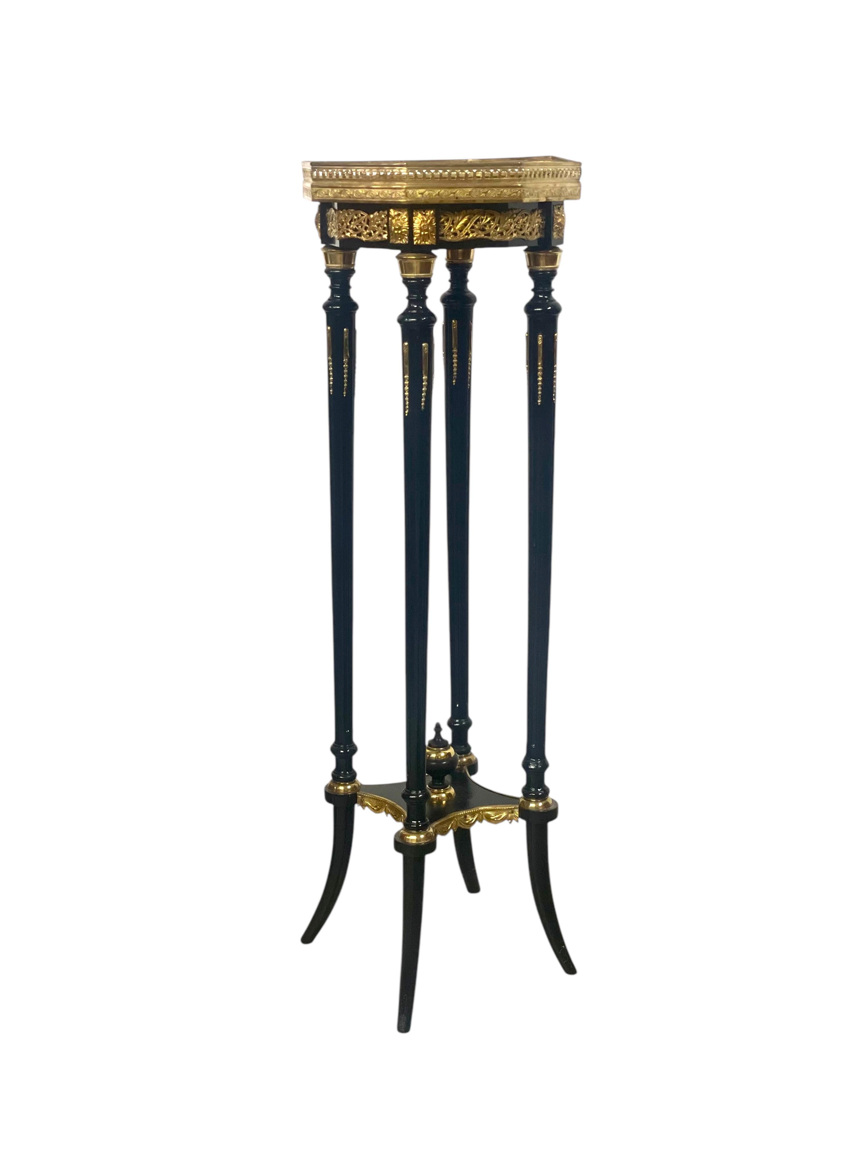 This exquisite French Napoleon III period pedestal stand from the late 19th century is a statement of refinement and craftsmanship. Designed with an octagonal onyx top, framed by an intricate gilt bronze gallery, this piece embodies the opulence and