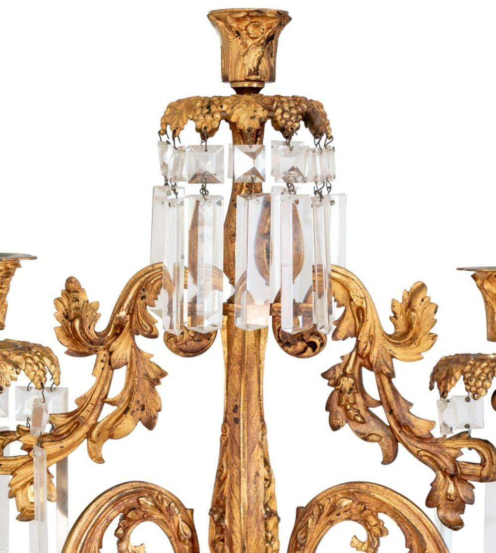 Napoleon III Ormolu Five-Branch Candelabrum, circa 1870, each branch suspended with cut glass prisms, the low branches articulated, overall with grape and vine decoration. 22.5