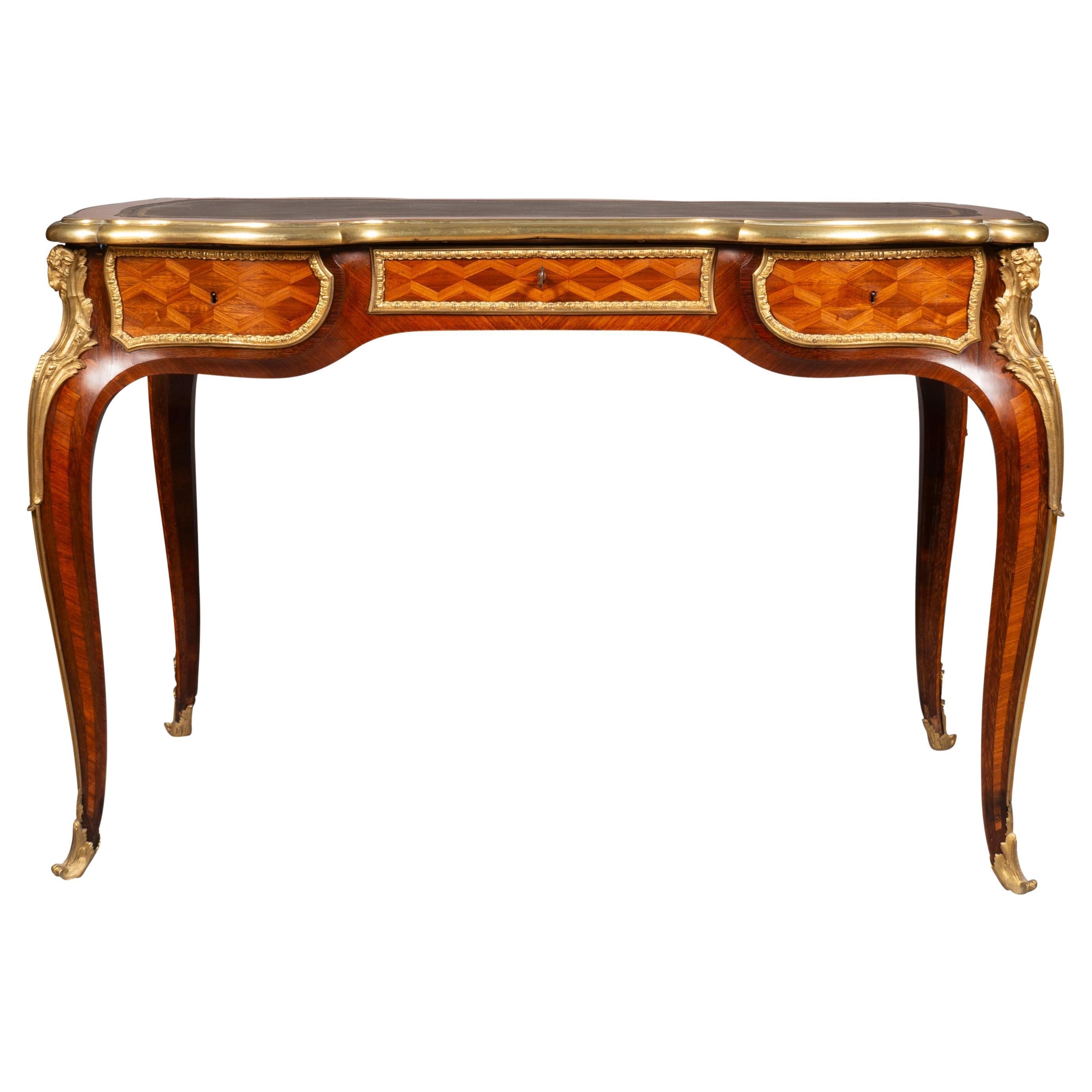 The identical desk and possibly the same one pictured in Les Ebenistes Du XIX Siecle by Denise Ledoux-Lebard. Page 621. Provenance Sothebys London November 27th 1964. A fine desk newly restored with new leather. Purchased from a Palm Beach estate.