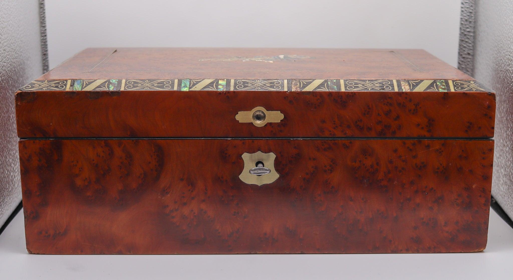 An antique Napoleon III traveler portable writing-desk box.

This is a gorgeous portable writing desk-box, created in France during the period of emperor Napoleon III, circa 1860. The piece is a fabulous and very decorative box, carefully crafted in