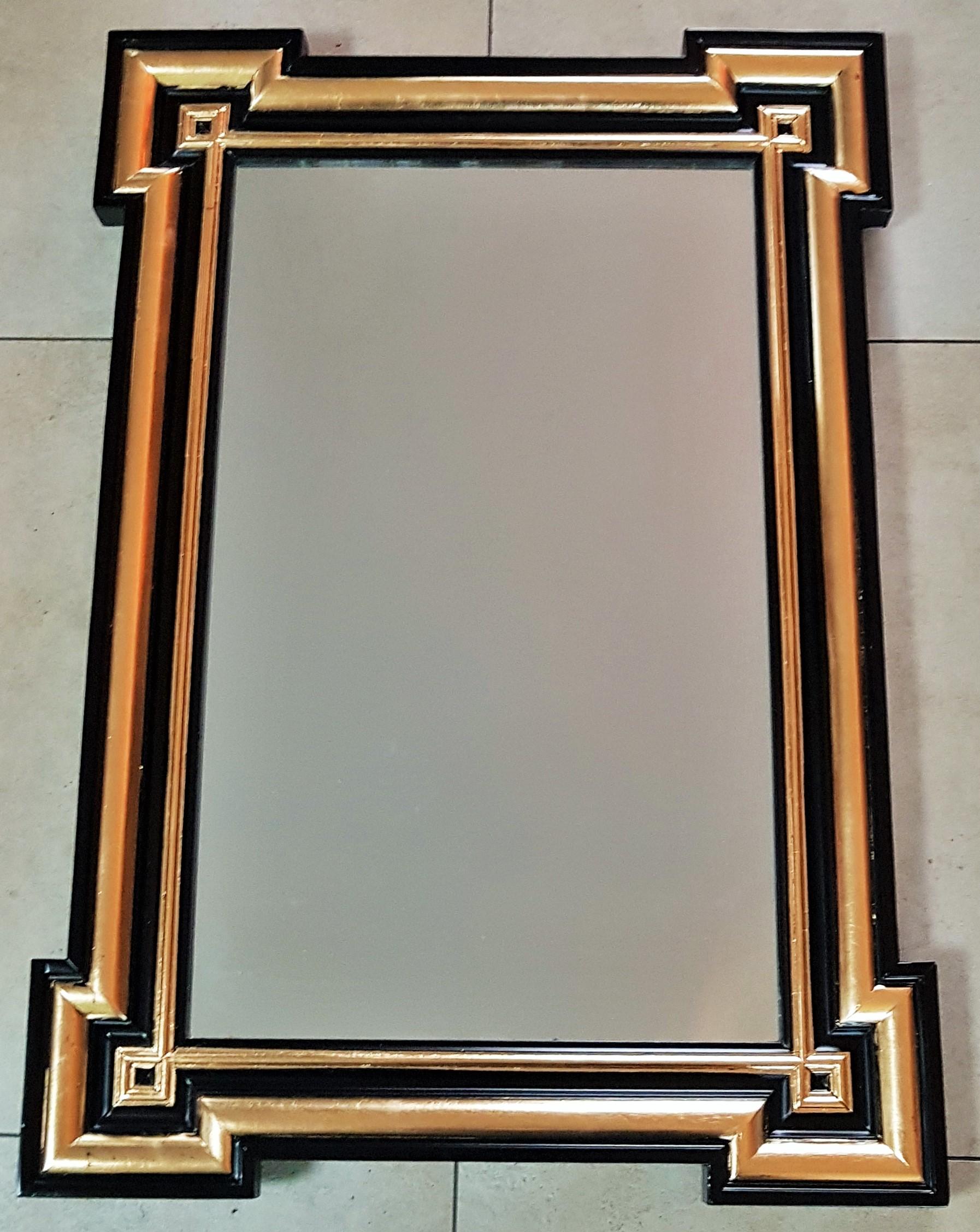 Napoleon III period black and gold mirror, France 1860.

Black lacquer, gold leaf.