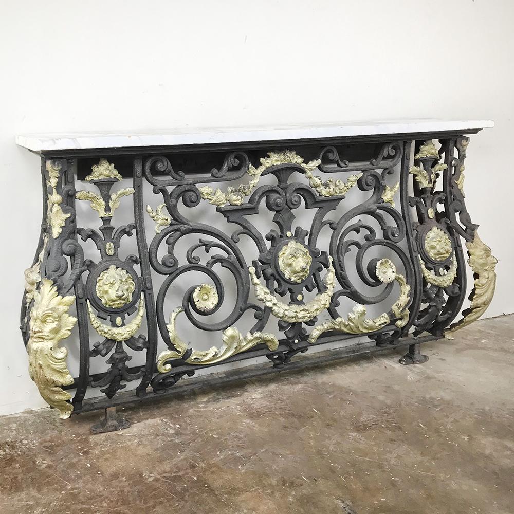 Napoleon III period wrought iron marble-top console was originally a balcony railing and has now been cleverly repurposed to create a singularly spectacular console which promises to make your entryway or any space into something truly unique and