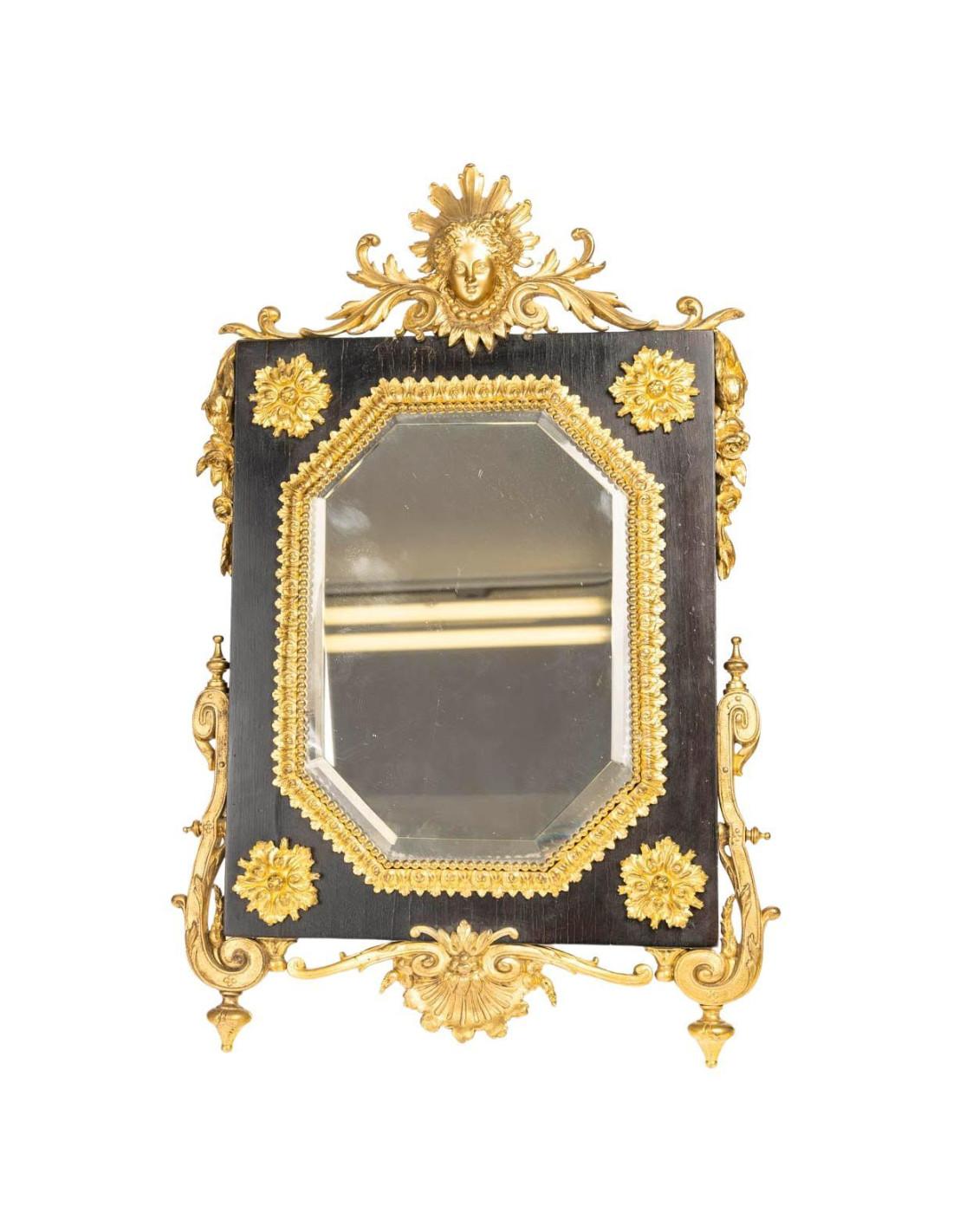 Napoleon III period chased gilt bronze table mirror .
Napoleon III period table mirror in chased and gilded bronze, beveled glass, 19thcentury antique.
H:50cm, W: 30cm, D:2cm