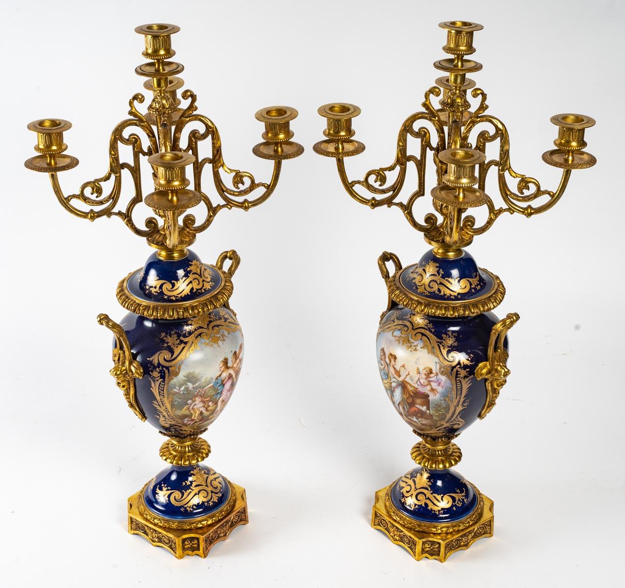Napoleon III period gilt bronze porcelain mantelpiece, 19th century.
Measures: Cartel - H: 57 cm, W: 30 cm, D: 23 cm
Candelabra - H: 64 cm, W: 27 cm, D: 27 cm.
   