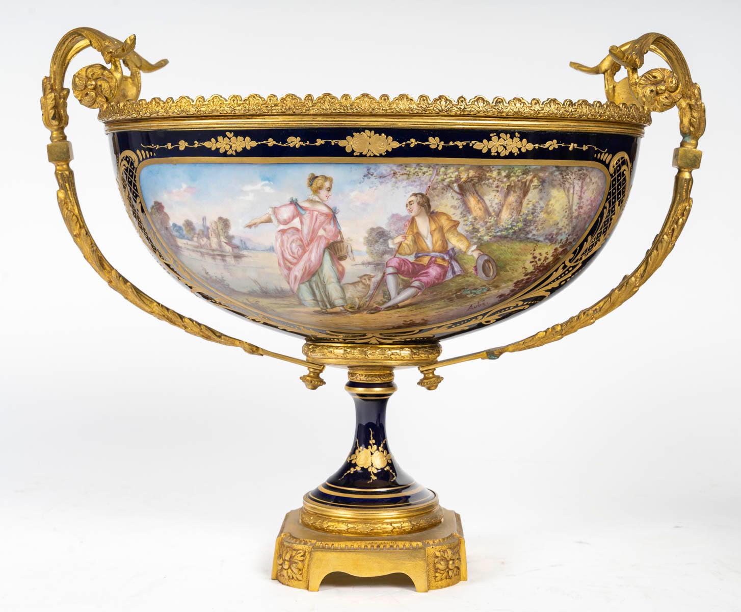 Napoleon III period mantel set, 19th century.

19th century Sèvres porcelain and gilt bronze mantel set, Napoleon III period.
Cassolettes: H: 43cm, W: 16cm, D: 13cm
Bowl: H: 33cm, W: 40cm, D: 21cm