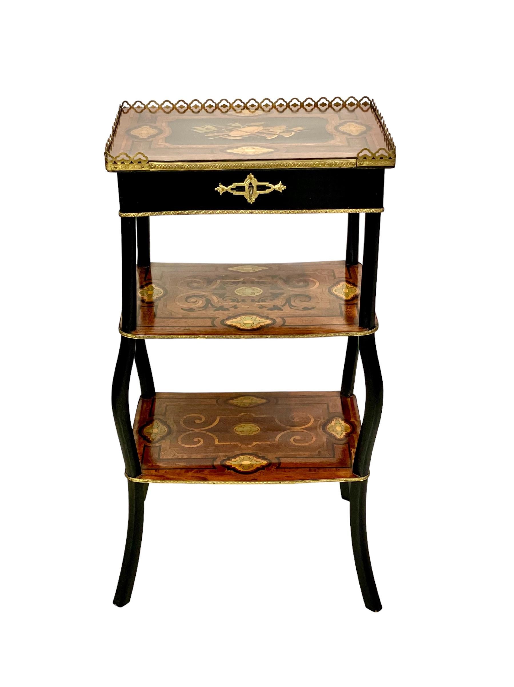 A very pretty Napoleon III period three-tier 'travailleuse', or work table, fitted out for use as an elegant vanity unit. The top tray opens with a hinged lid to reveal a mirrored back and a luxurious pink velvet-lined compartment, capacious enough