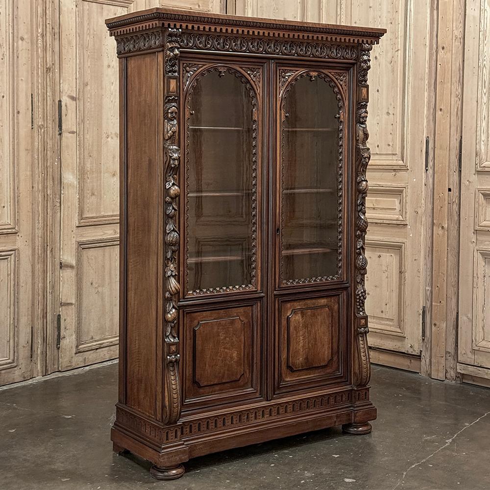 Napoleon III Period Walnut Bookcase showcases the talents of French master furniture crafters, executed in sumptuous French walnut and as sturdy as a vault!  Starting with three distinctively carved tiers in the crown molding above, one sees egg &