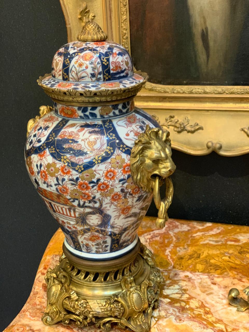 A very fine Napoleon III polychrome porcelain fireplace garnish with floral decoration. Ornamentation in gilded bronze of 
