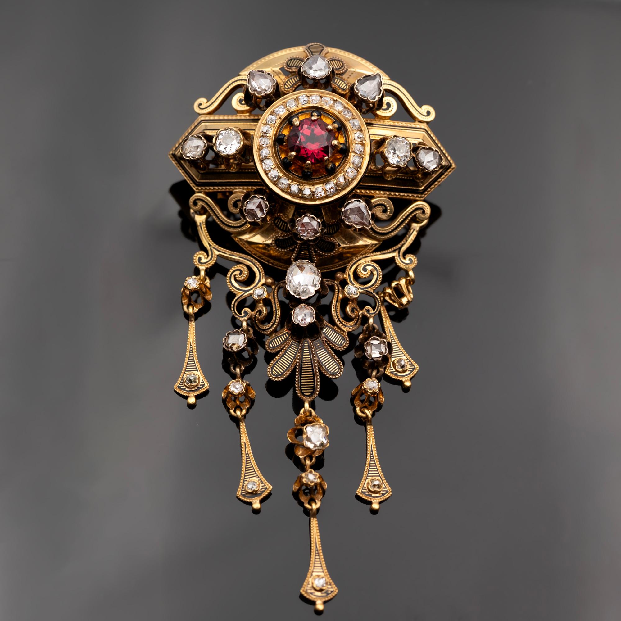 This exceptional Napoleon III (French Second Empire) brooch, offered by Claris-A, captures the elegance and ornate craftsmanship of mid-19th-century French jewelry. French-stamped, it centers a richly colored rhodolite garnet framed by shimmering