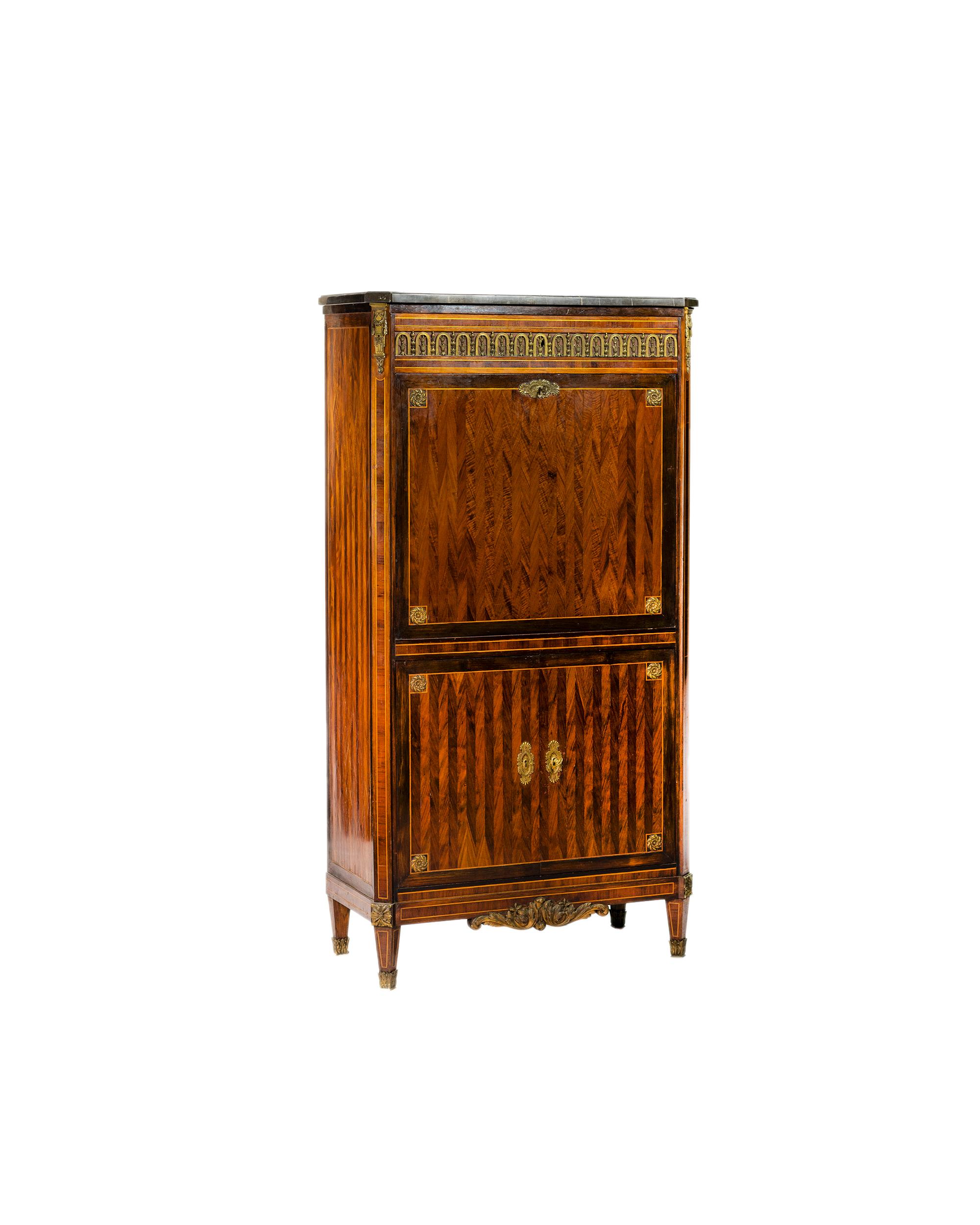 A unique secretaire abattant cabinet with drop down writing panel with interior carved wooden rails in a yellow color wood finish. 
The fall front has a green leather writing surface. 
The upper section is crowned by a rectangular bleu turquin