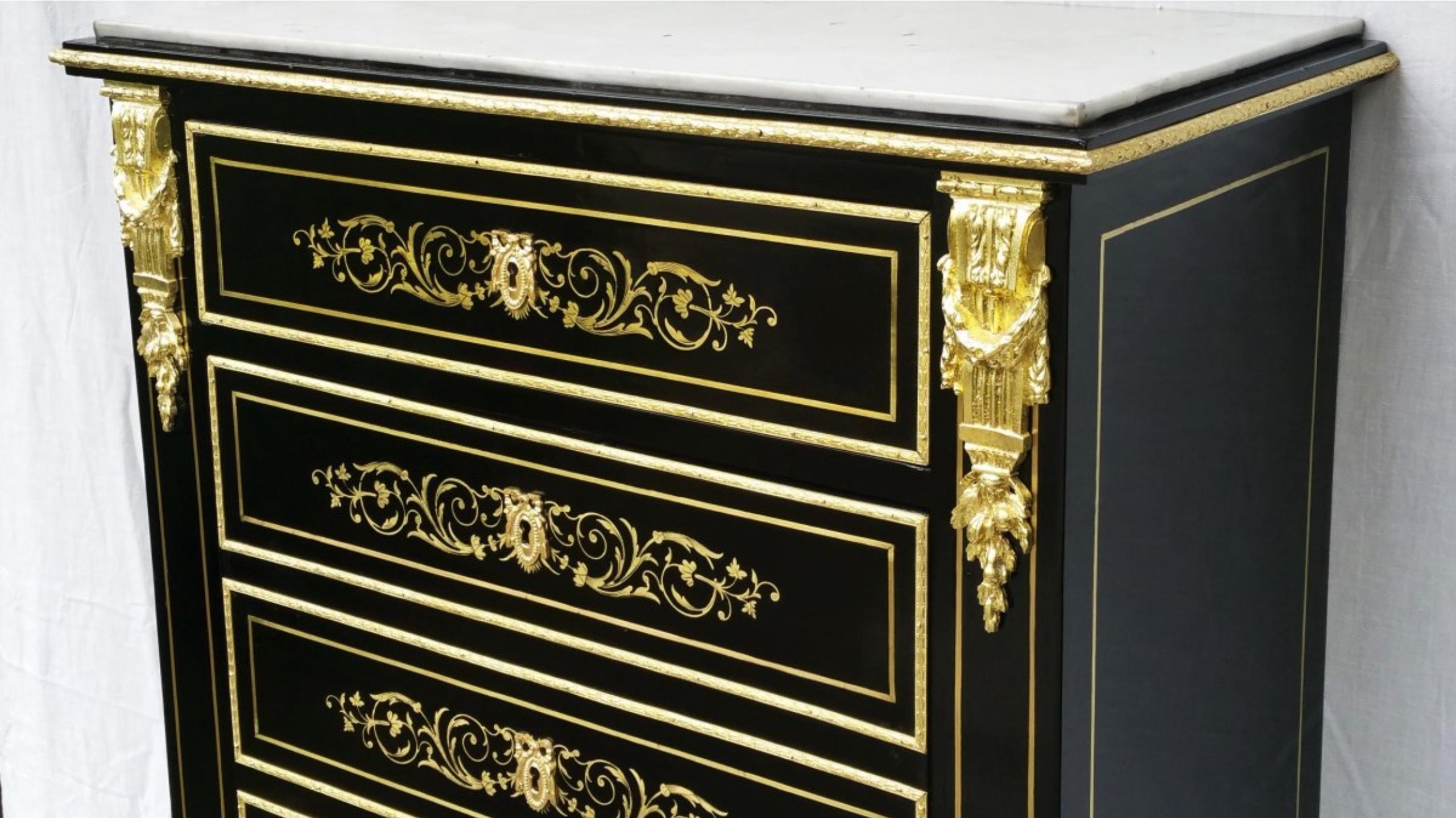 Napoleon III secretary in false week style blackened wood veneer with Boulle style marquetry with brass and gilt bronze ornaments and a white Carrara marble top. Opens on a very elegant theatre in noble wood burl and amaranth, 2 drawers are