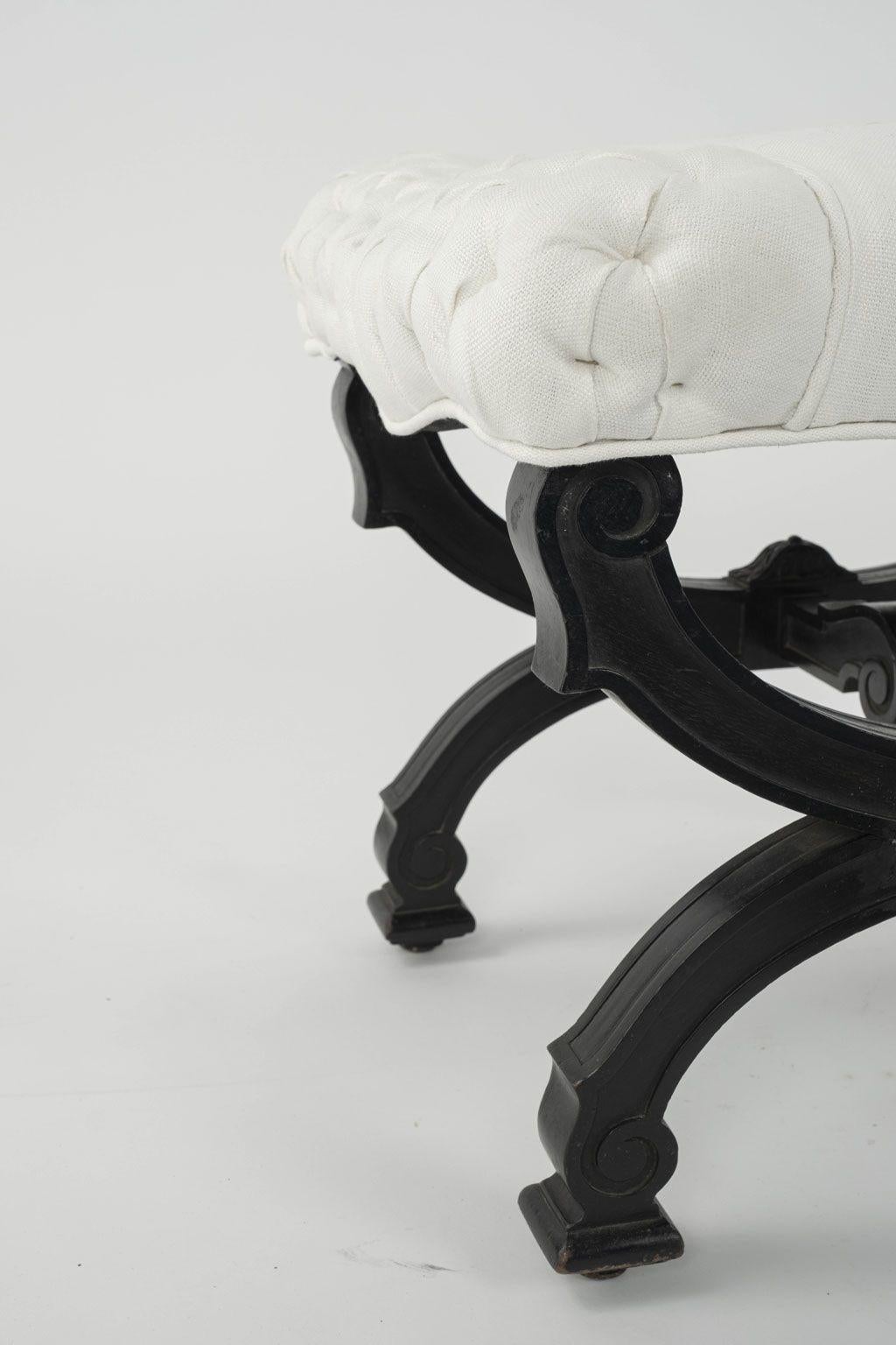 Napoleon III stool, circa 1870-1889: ebonized frame newly covered in white linen.

Note: Regional differences in humidity and climate during shipping may cause antique and vintage wood to shrink and/or split along its grain, veneer to loosen and/or