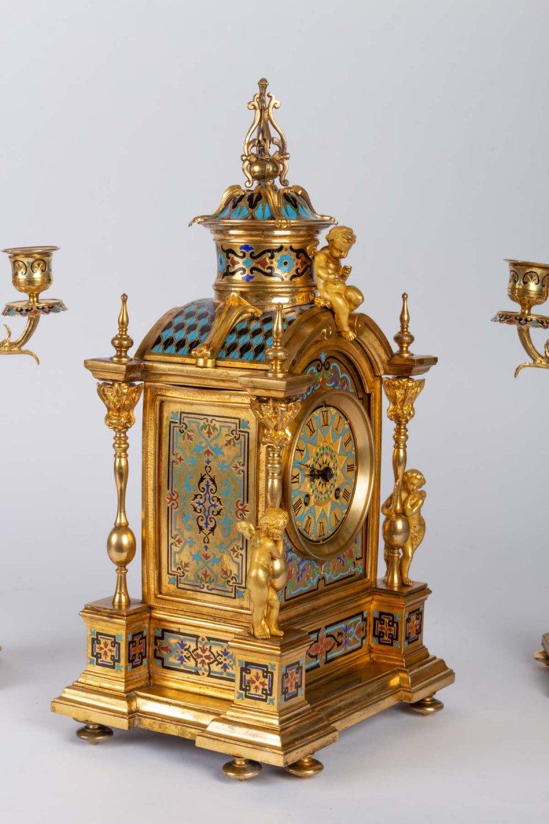 Napoleon III style bronze and cloisonné enamel mantel set
in the Napoleon III style, consisting of a clock and a pair of five-branched candelabras. Nice quality of chasing with putti and cherubs decorations
old gilding with mercury just cleaned
A