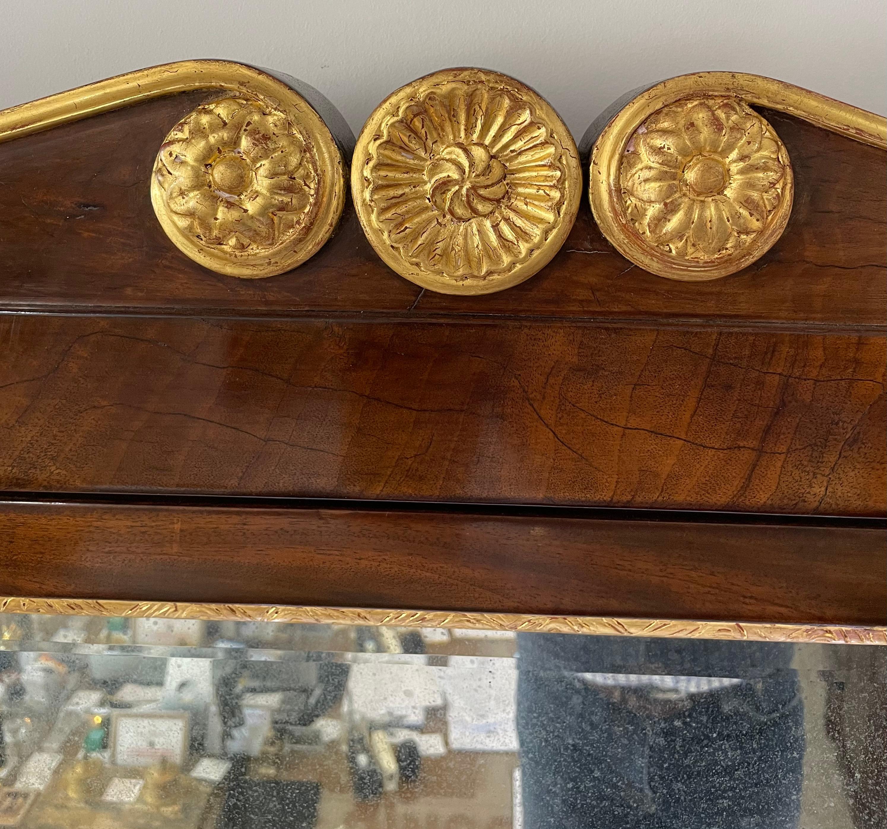 This stylish and chic Napoleon III style console with mirror was acquired from a Palm Beach estate and it will make a statment with it scale, form and use of materials.  The piece is fabricated in mahogany wood, carrara marble and gilt gold leaf.