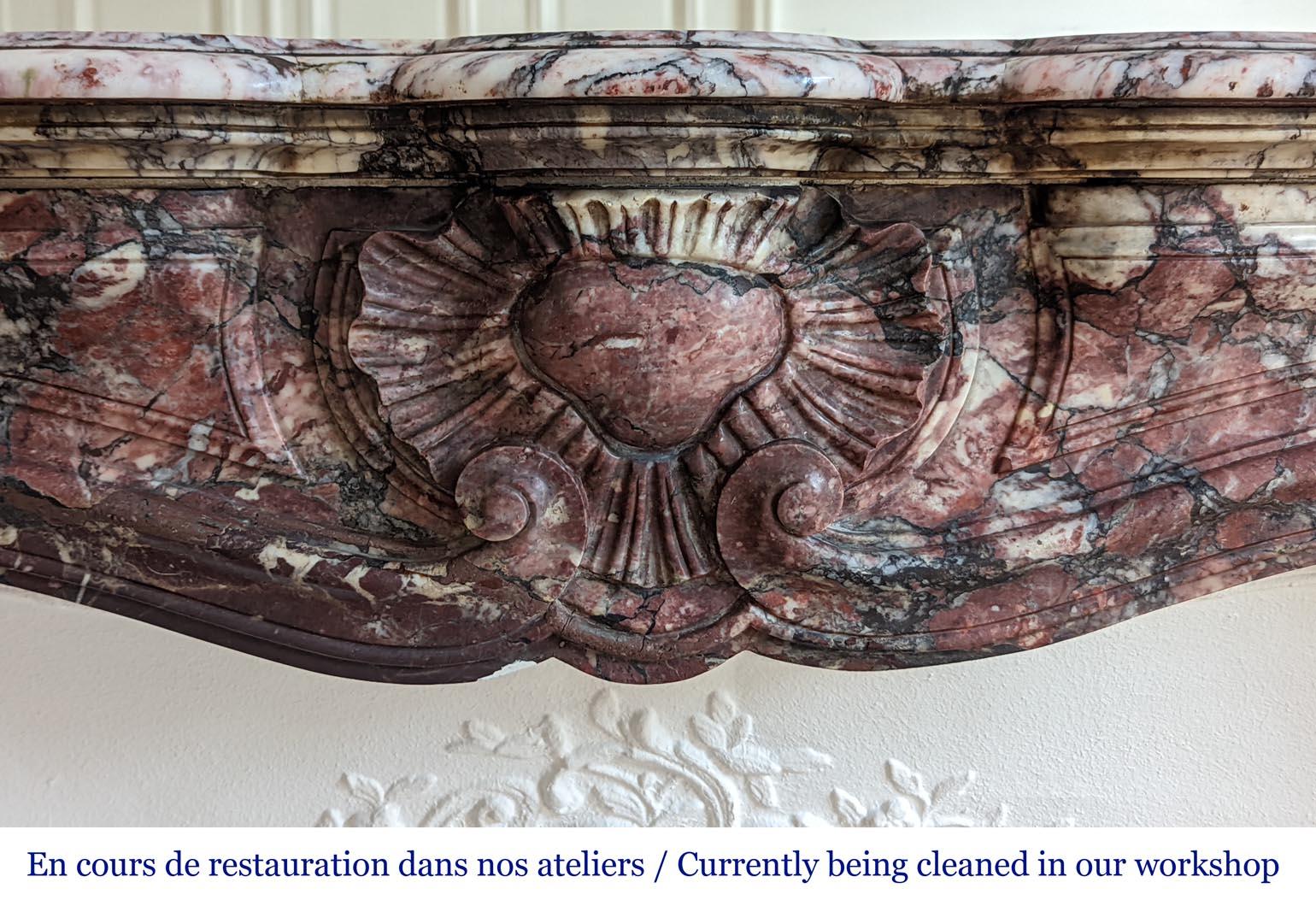 Napoleon III style Fleur de pêcher marble mantel.
Fleur de Pêcher marble is a historic marble, used a lot during the 19th century to make exceptional works of art. For example the extraordinary fireplace in main hall of the Napoleon III appartments