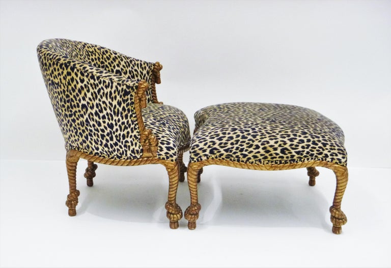 Giltwood rope-twist armchair and ottoman made in Italy in the manner of A.M.E Fournier, Napoleon III Style. Both feature solid carved giltwood frames, upholstered in leopard print. This seat is perched atop hearty knots of rope and evokes the true