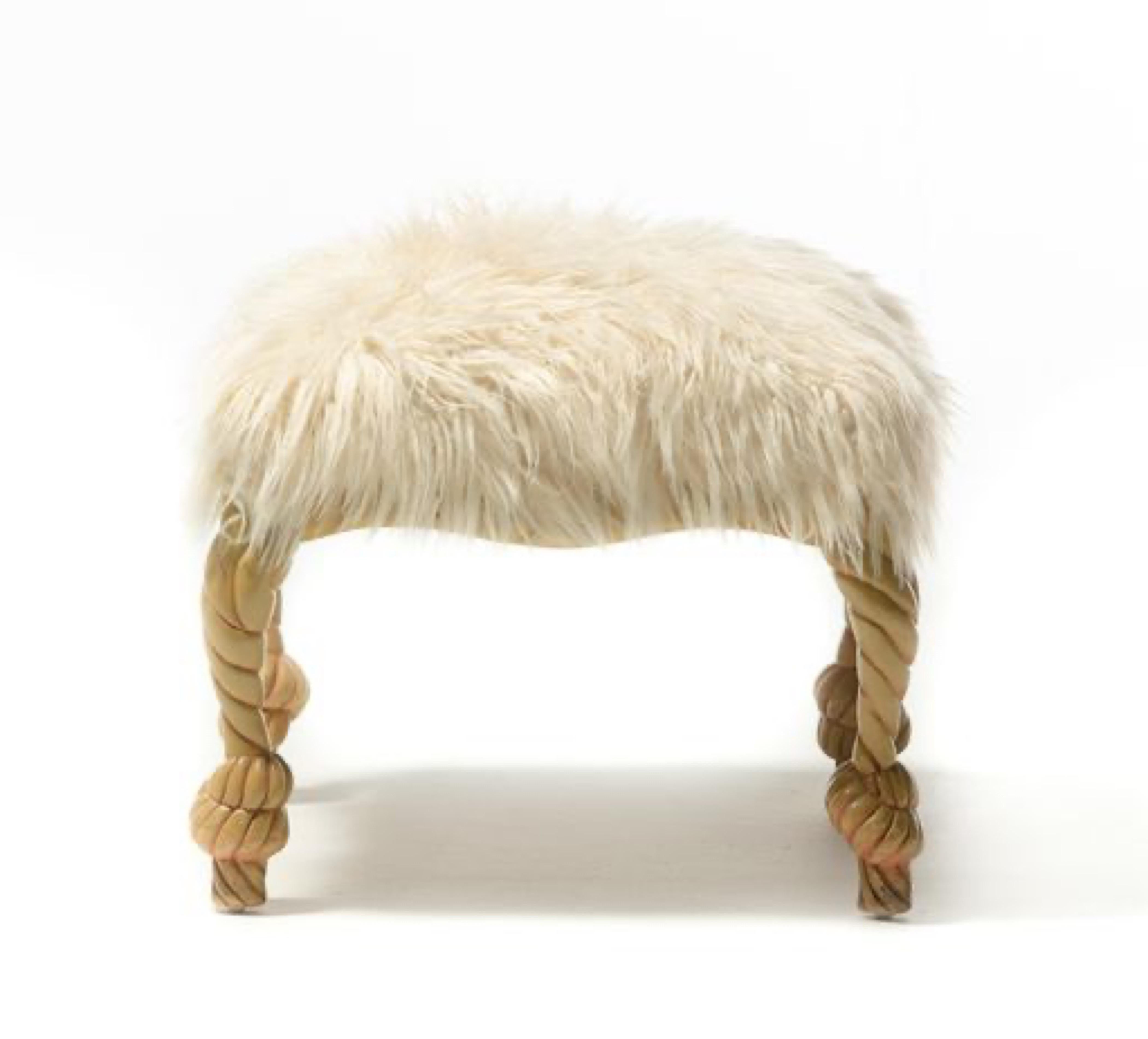 Glamorously Chic Faux Fur Carved Rope ottoman. In the style of Parisian Upholsterer A.M.E. Fournier. Sculptural carved frame has the illusion of knotted rope. This ottoman could be used on its own as a stool or paired with a chair as an ottoman. 