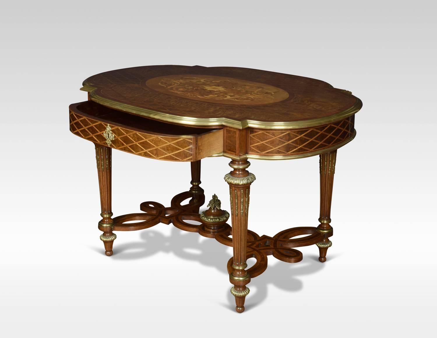A centre table of exceptional quality, utilizing beautifully grained woods, including walnut, thuya, rosewood, tulipwood, amaranth and fruitwood. Adorned with very fine planished and gilded ormolu mounts. The shaped parquetry top, with everted