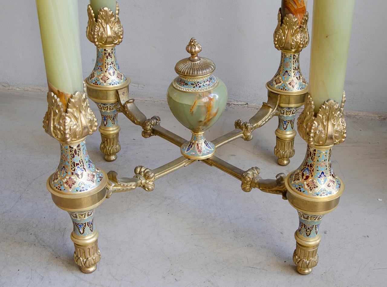 Napoleon III table
Circa 1870 19th century
gilt bronze, onyx and champleve enamel
origin France in perfect condition.
The Napoleon III style had its heyday during the 1850s and 1880s. Emperor Napoleon wanted to emulate the lavishness and elegance of