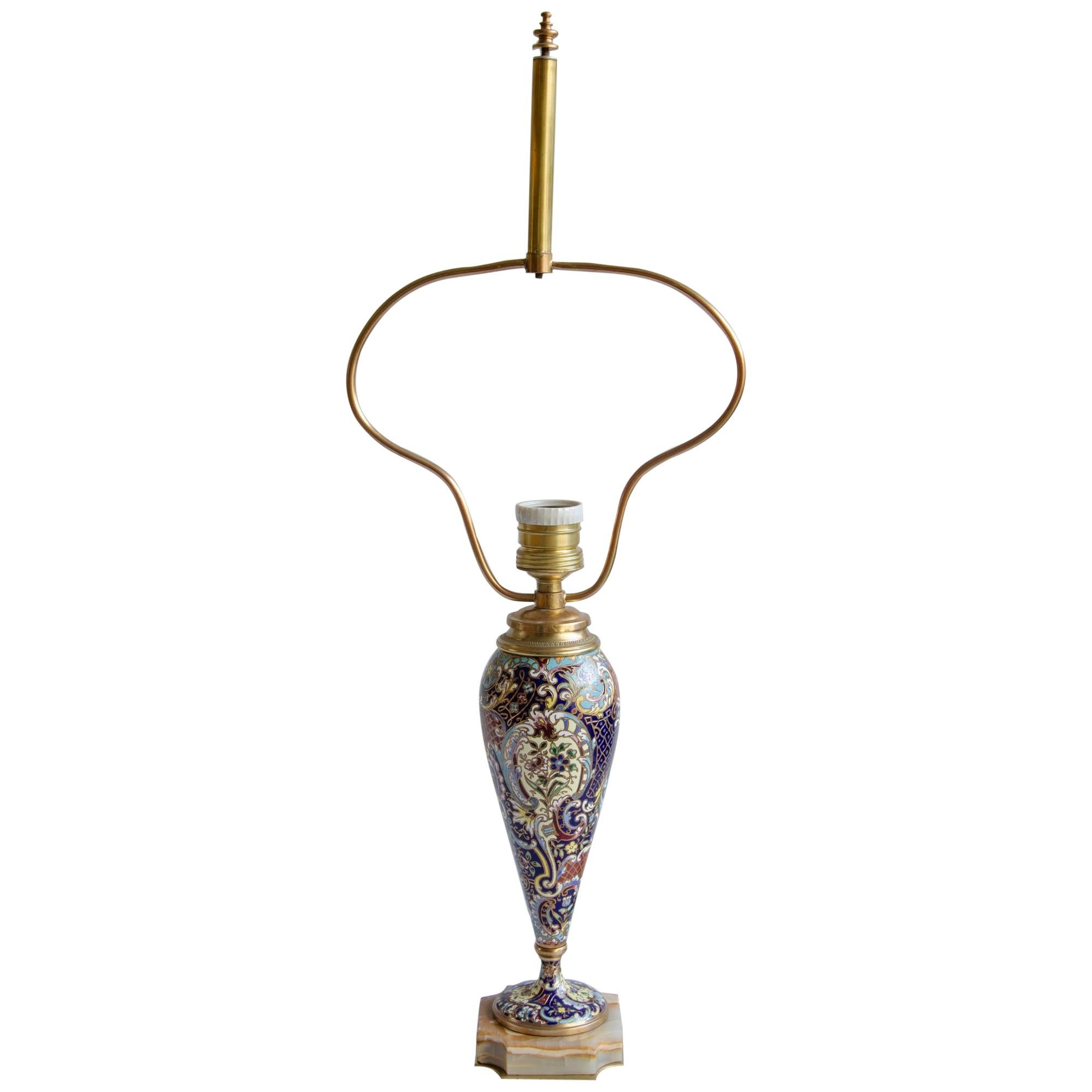 Napoleon III table lamp
onix base, enamel champlevé,
circa 1900 origin France electrified 220 w
perfect condition.
The Napoleon III style had its heyday during the 1850s and 1880s. Emperor Napoleon wanted to emulate the lavishness and elegance of