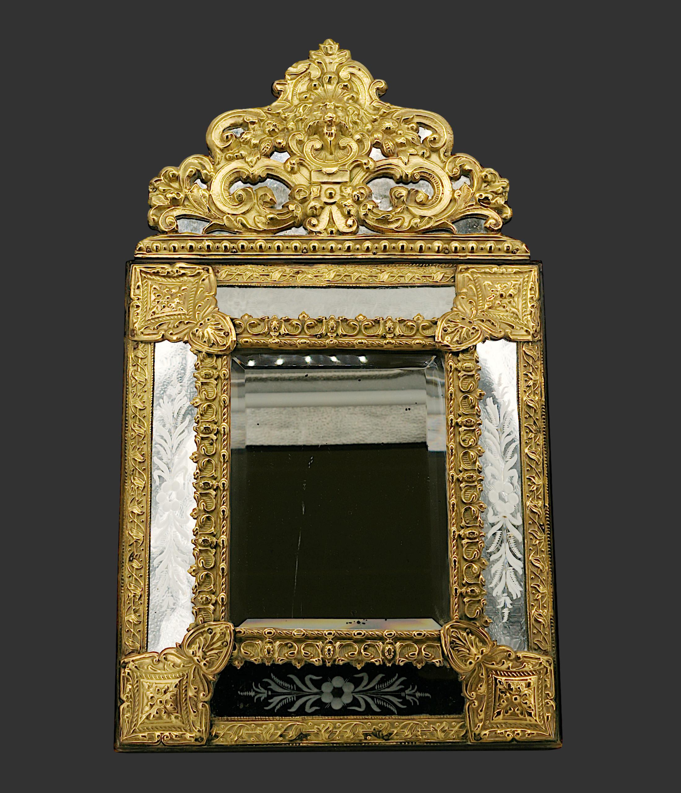French Napoleon III wall & table mirror, France, 1880s. Mirror that can ve hung on a wall or placed on a table. Glazing bead mirror with beveled central mirror and engraved exteriors. Stamped brass. 