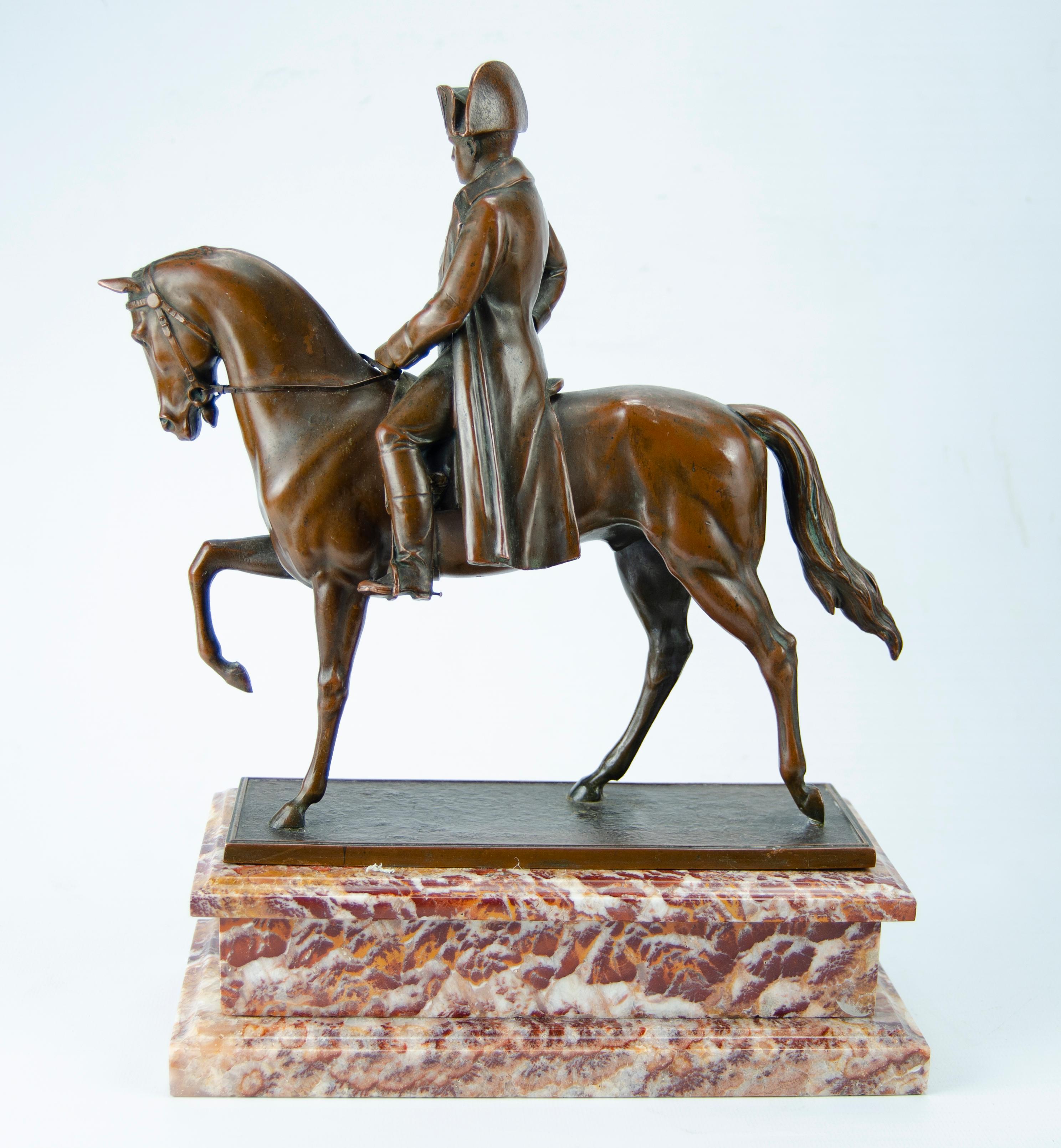 Napoleon on horseback sculpture
 Moroccan onix marble base
Figure in white metasl with coppery patina
Circa 1900 origin Austria.