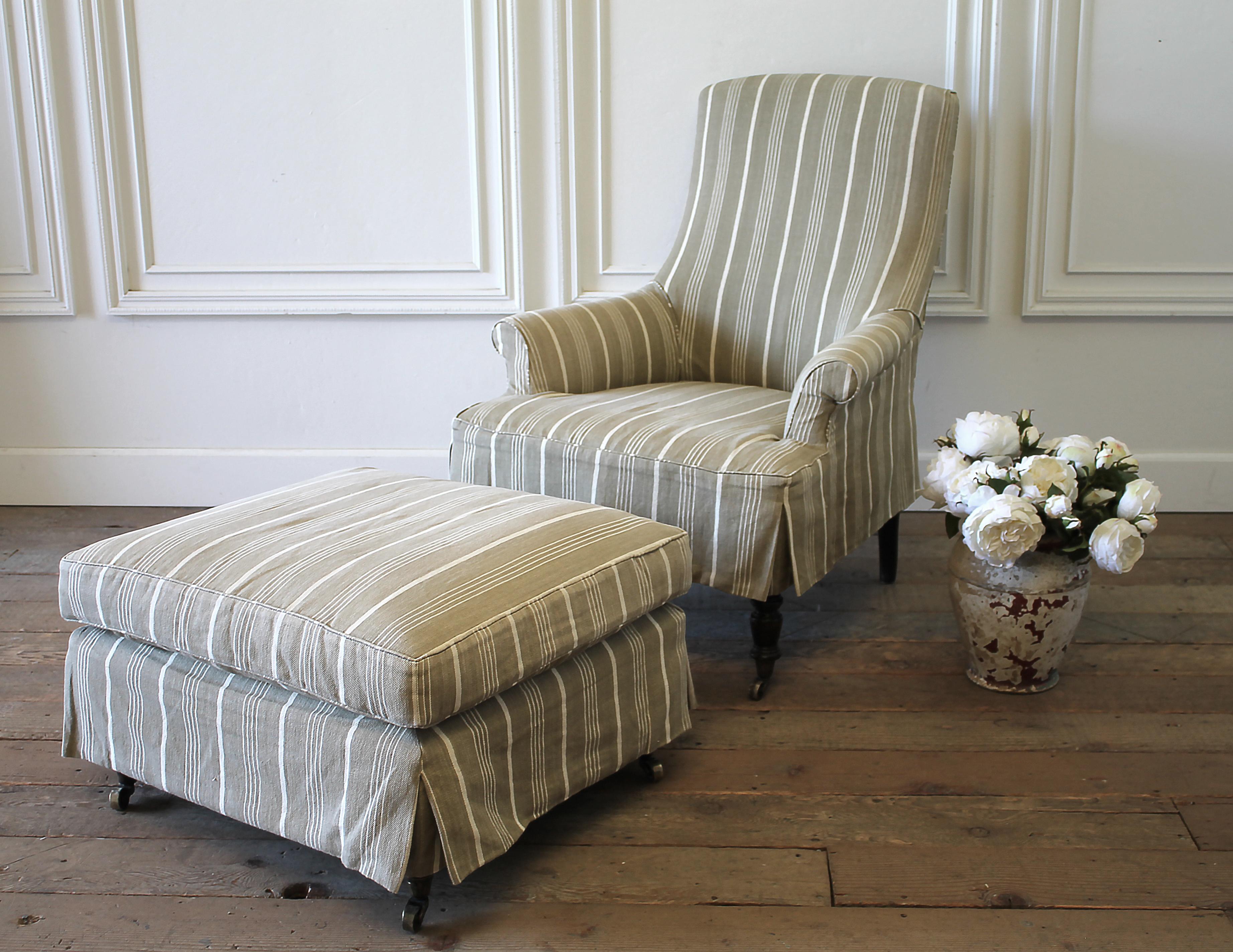 Napoleon style chair and ottoman with linen stripe slip cover
Custom-made chair with muslin upholstery, and French ticking linen stripe slip cover. The chair and ottoman have a dark espresso carved legs with brass caster wheels.
The ottoman has a