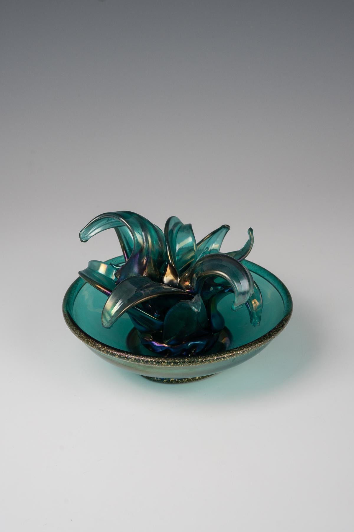 Napoleone Martinuzzi, a 'Pianta Grassa' sculpture, ca. 1930

green pulegoso glass, iridescent surface
executed by Venini & C., Murano, Italy
18 cm (height)
signed with two-line acid stamp „venini murano“

perfect condition

LITERATURE
a reference to