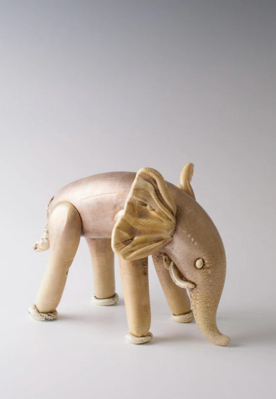Napoleone Martinuzzi (1892-1977), rare 'Elefante', ca. 1933 for Venini
vetro lattimo with gold leaf application
produced by Venini & C., Murano, Italy
20 x 30 x 20 cm 

LITERATURE
similar example referenced in the following:
M. Barovier, A.