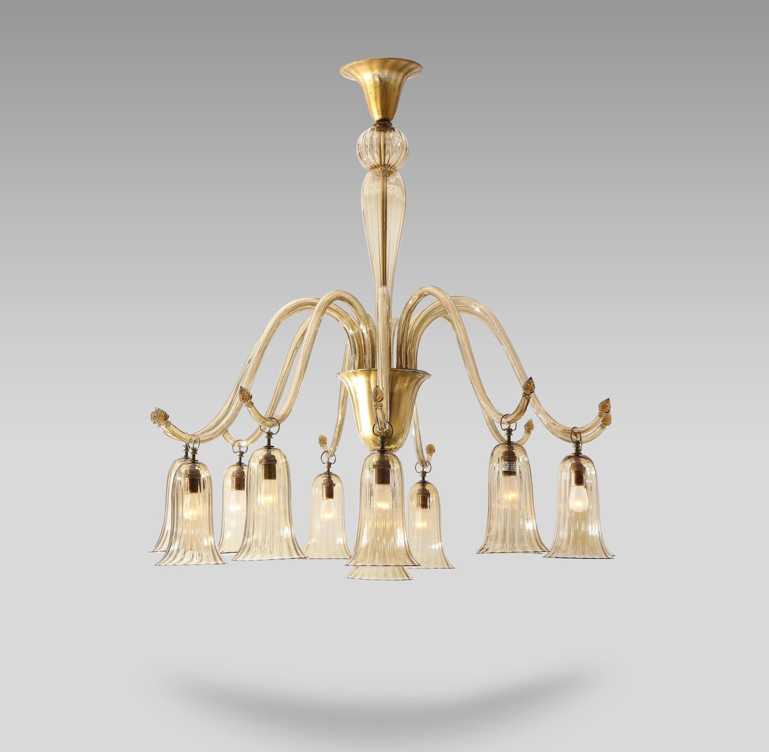 12-light chandelier #2073 by Napoleone Martinuzzi for Venini. Extraordinary example of an early and large Martinuzzi form. Comprised of hand-blown glass and a metal structure. Each of the 11 arms ends with one hanging glass shade surrounding a