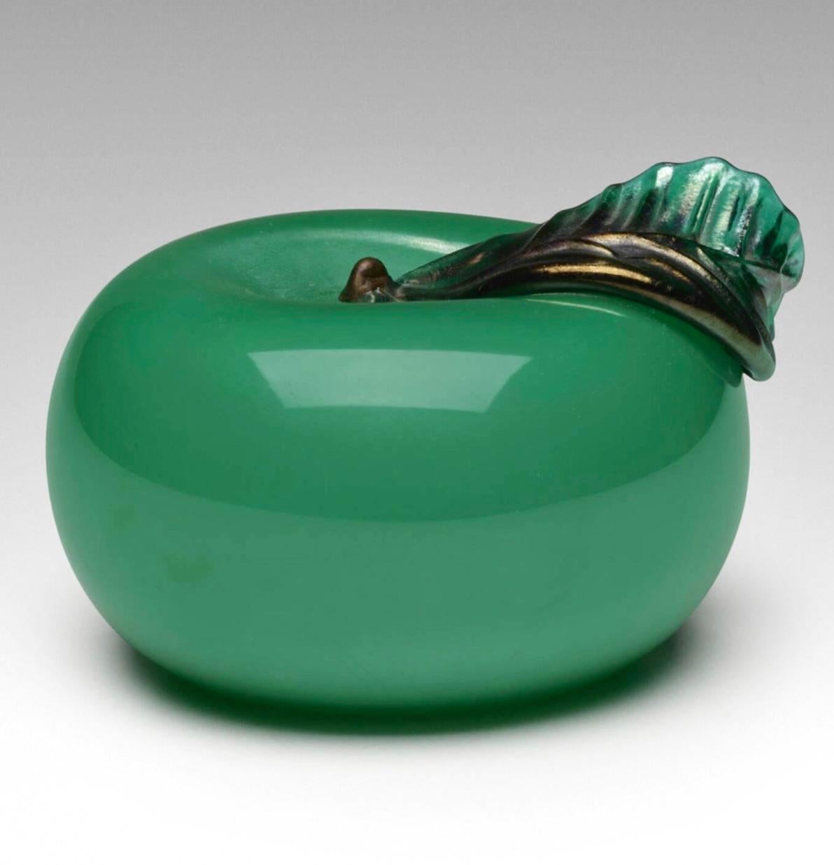 Napoleone Martinuzzi for Venini Murano Art Glass Green Apple Sculpture, Italy, c. 1926. acid-etched signature;  Murano green cased glass with applied gold leaf.
2.75 h x 4 w x 4.5 d in (7 x 10 x 11 cm). Signed with three-line acid stamp to underside